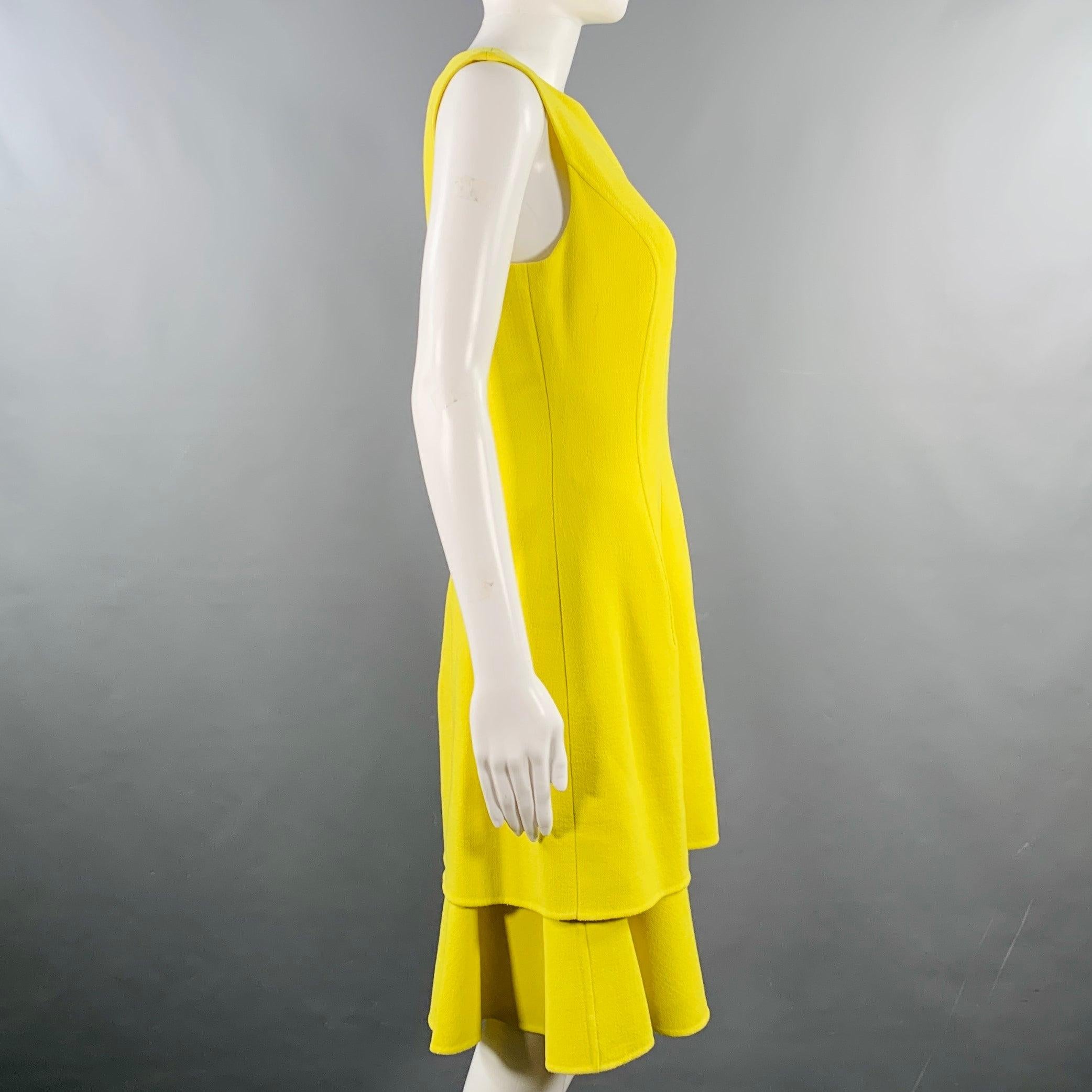 OSCAR DE LA RENTA cocktail dress
in a neon yellow virgin wool stretch blend crepe featuring a sleeveless style, tiered skirt, and invisible back zipper closure. Made in Italy.Excellent Pre-Owned Condition. 

Marked:   6 

Measurements: 
 
Shoulder: