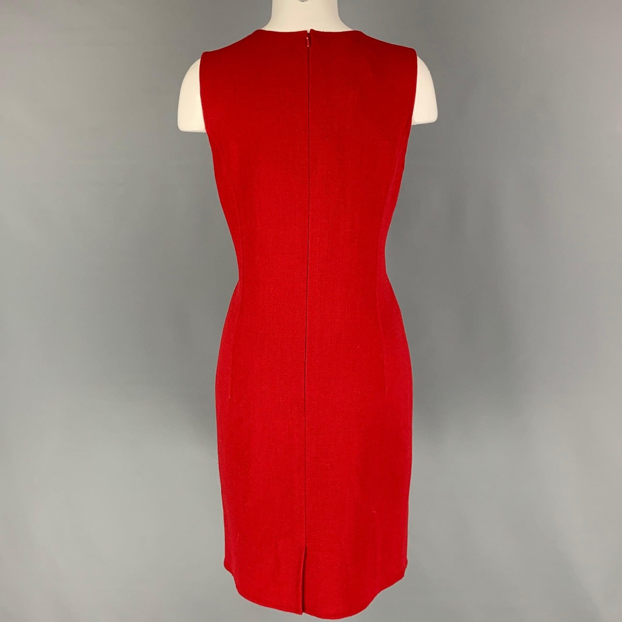 OSCAR DE LA RENTA dress comes in a red virgin wool blend featuring a shift style, sleeveless, and a back zip up closure. Matching jacket sole separately. Made in Italy.
New With Tags. 

Marked:   6 

Measurements: 
 
Shoulder: 13.5 inches  Bust: 36