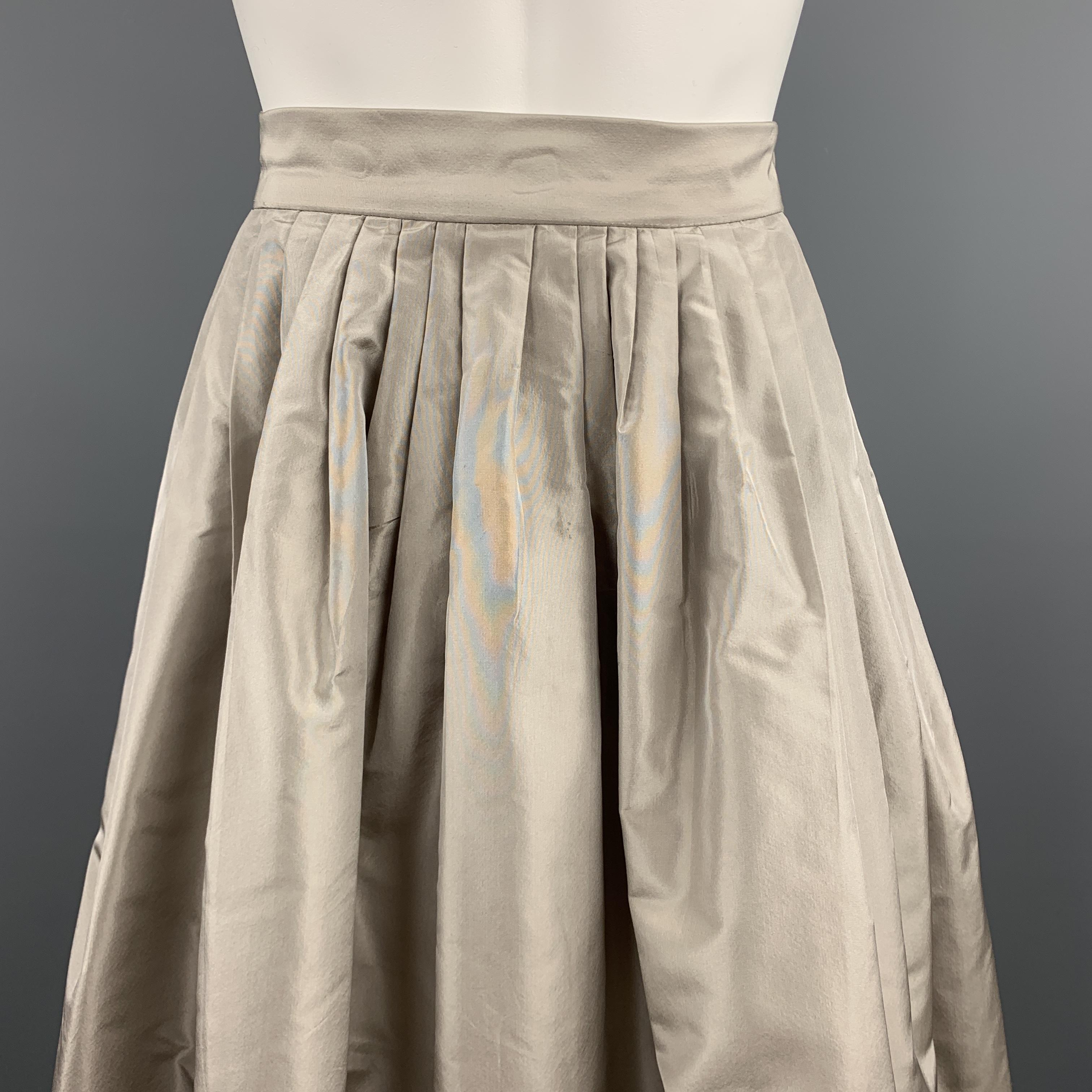 OSCAR DE LA RENTA Spring 2012 ball skirt comes in taupe grey silk taffeta with a pleated A line silhouette. Spot on front. As-is. Made in USA.

Good Pre-Owned Condition.
Marked: US 6

Measurements:

Waist: 28 in.
Hip: 60 in.
Length: 36 in.
