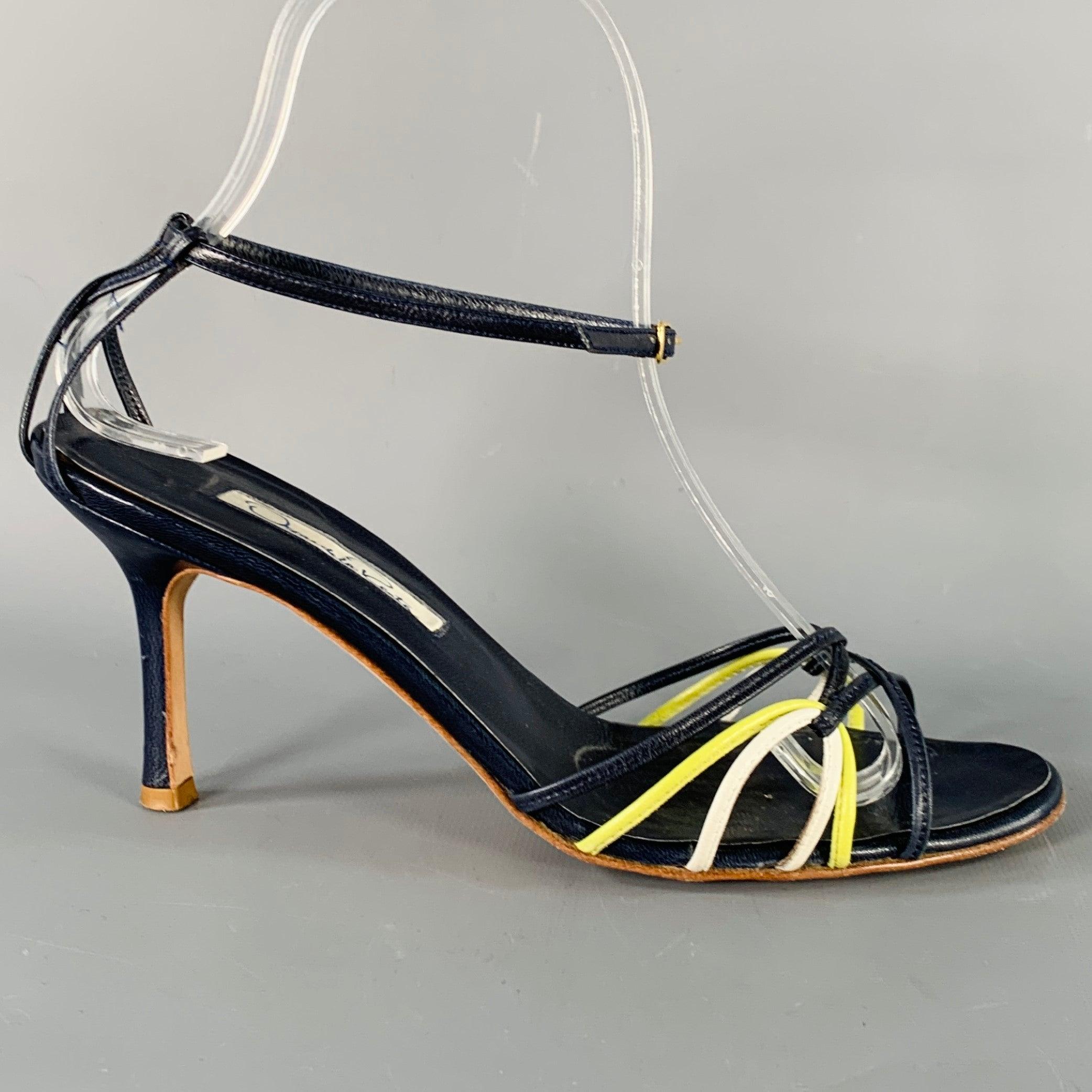 OSCAR DE LA RENTA sandals
in a navy and yellow leather featuring a strappy design, and ankle strap buckle closure. Made in Italy.Very Good Pre-Owned Condition. 

Marked:   IT 37 

Measurements: 
  Heel: 3 inches 
  
  
 
Sui Generis Reference: