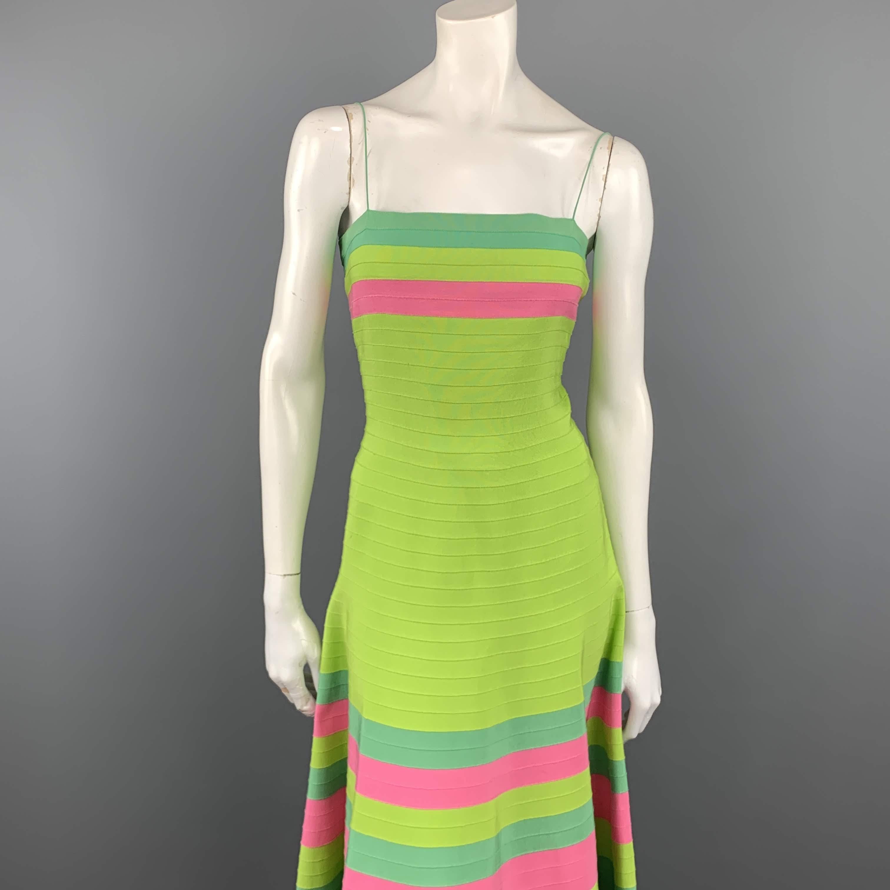 Vintage OSCAR DE LA RENTA down comes in lime green grosgrain ribbon with turquoise and pink color block stripe pattern, straight bustier neckline, skinny straps, and flaired skirt. Spots shown in detail shots. As-is. Made in USA.
 
Very Good
