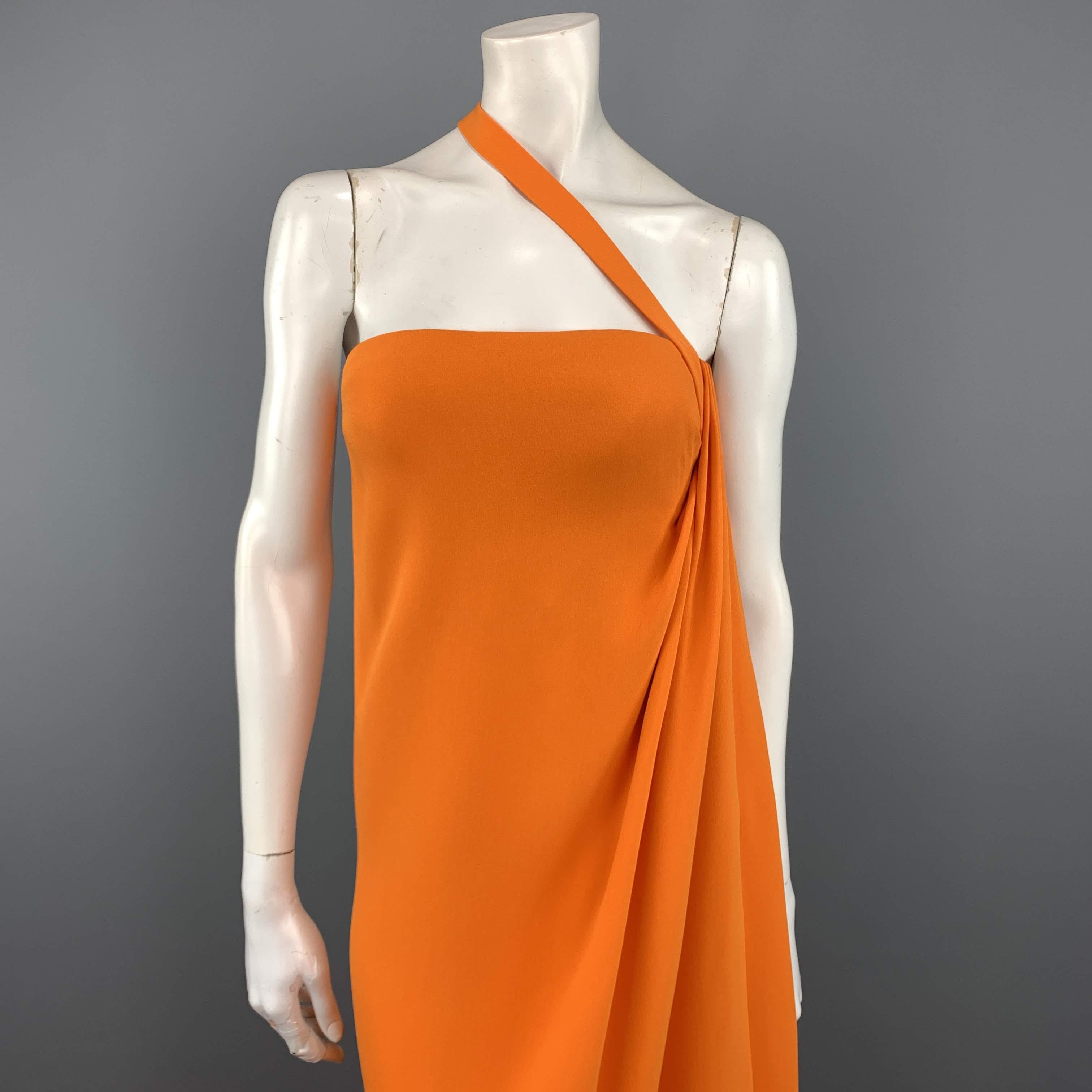 OSCAR DE LA RENTA Resort 2008 Collection gown comes in vibrant orange silk with a bustier top detailed with a diagonal strap, asymmetrical gathered pleat side, and long A line silhouette. Made in USA.
 
Excellent Pre-Owned Condition.
Marked: 8
