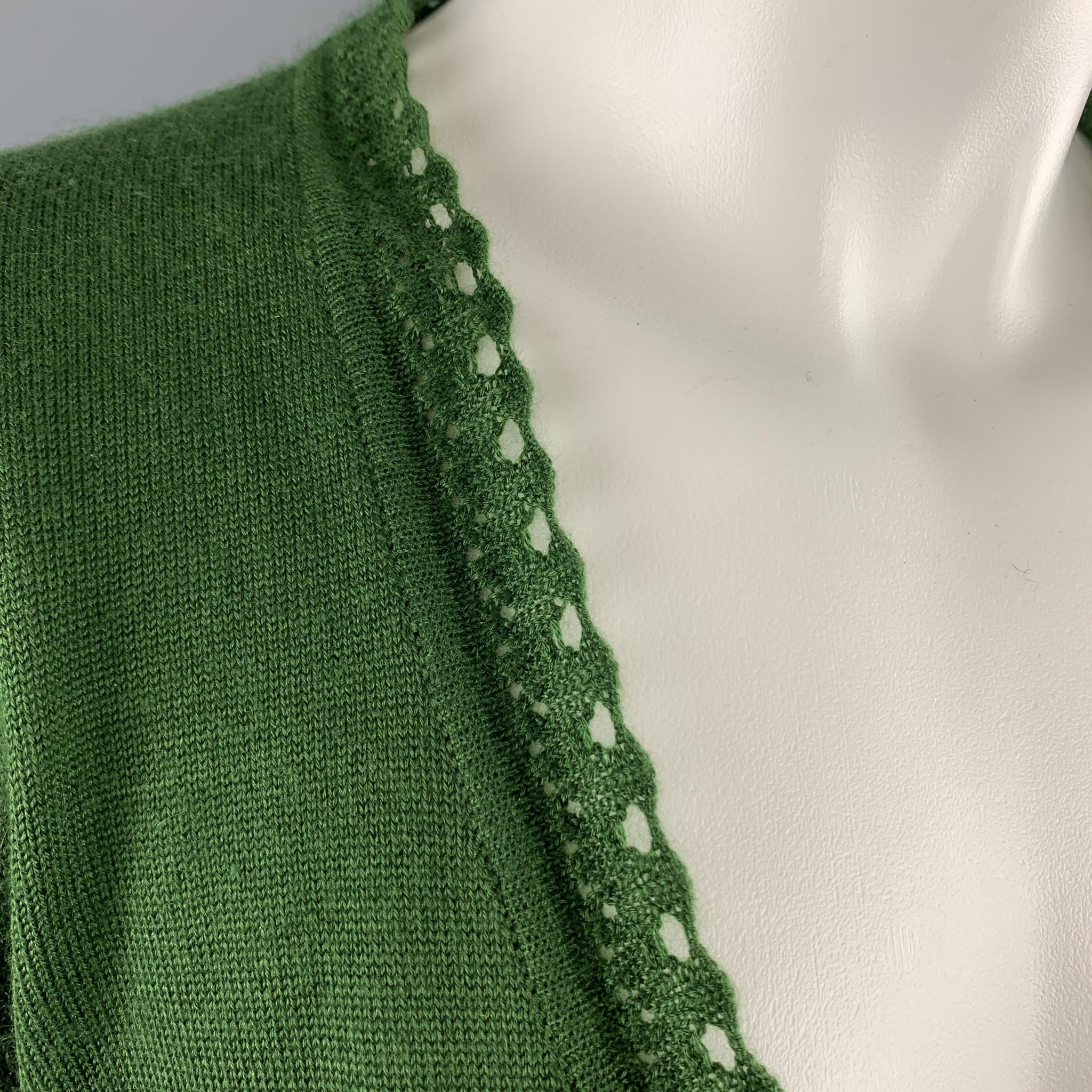 OSCAR DE LA RENTA cropped bolero cardigan comes in green cashmere silk blend knit with an open front and lace trim. Wear throughout. As-is. Made in italy.

Good Pre-Owned Condition.
Marked: M

Measurements:

Shoulder: 14.5 in.
Bust: 36 in.
Sleeve: