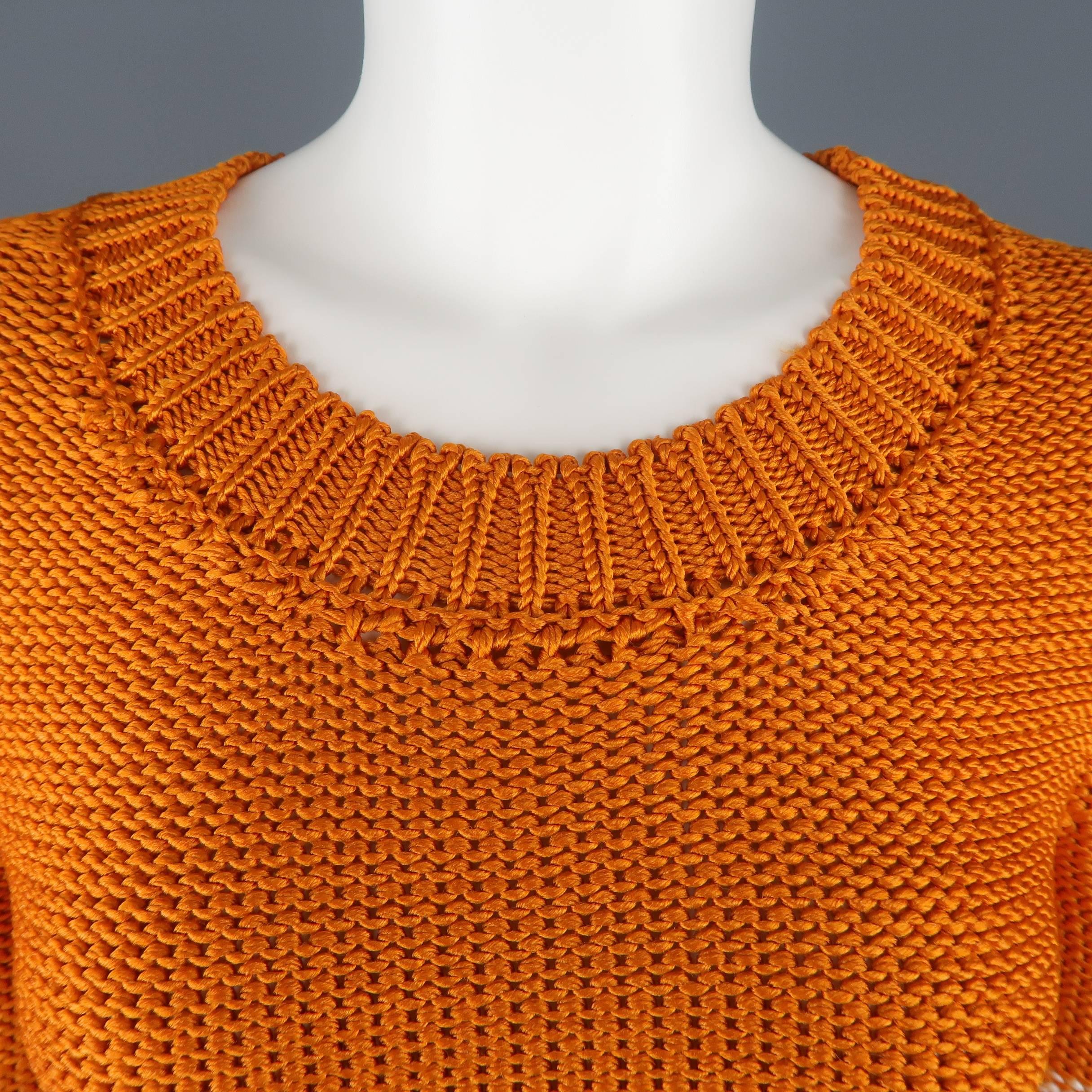 OSCAR DE LA RENTA pullover sweater comes in an orange silk knit with cream stripes with a round crewneck and three quarter sleeves. Made in France.

Retail: $1500
Excellent Pre-Owned Condition.
Marked: M
 
Measurements:
 
Shoulder: 13 in.
Bust: 36