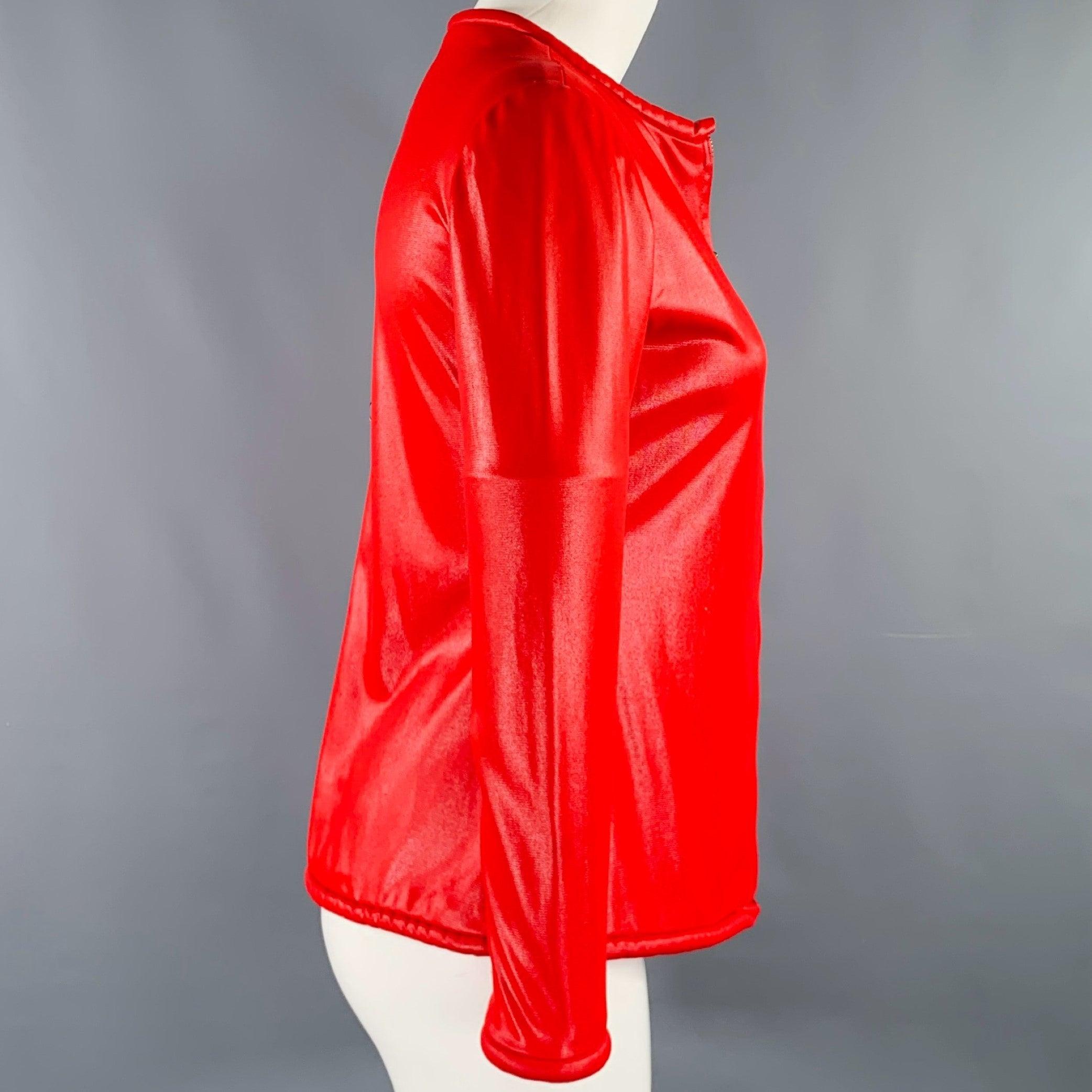 Vintage OSCAR DE LA RENTA SWIMWEAR cover-up jacket
in a red stretch fabric featuring a collarless style, long sleeves, and zip up closure with brass O-ring zipper pull.Very Good Vintage Condition.
Moderate mark on left side which is hard to see