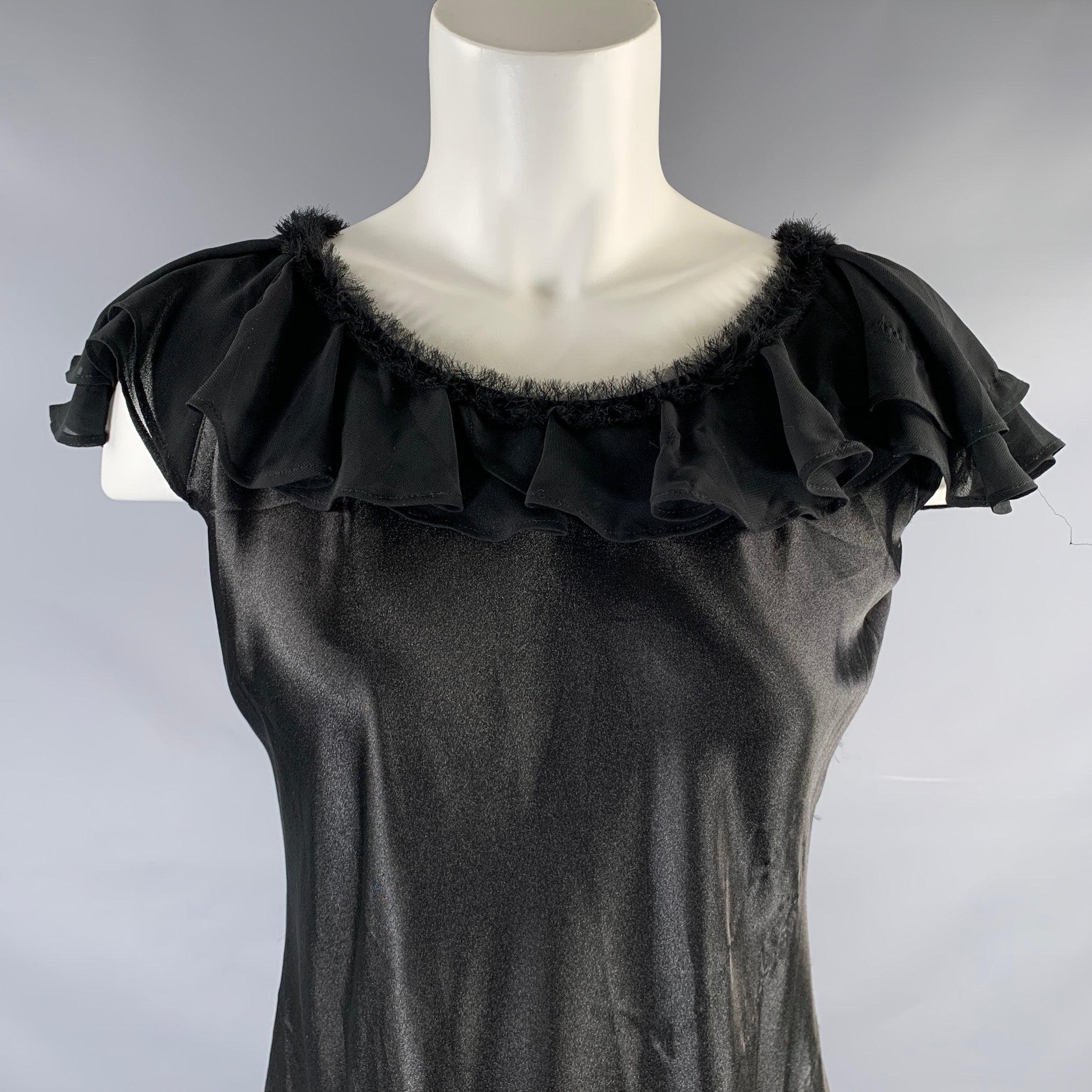 OSCAR DE LA RENTA PINK LABEL dress
in a black polyester fabric featuring an above knee style with butterfly sleeves, and raw edge neckline.Very Good Pre-Owned Condition. Minor signs of wear. 

Marked:   S 

Measurements: 
 
Shoulder: 11 inches