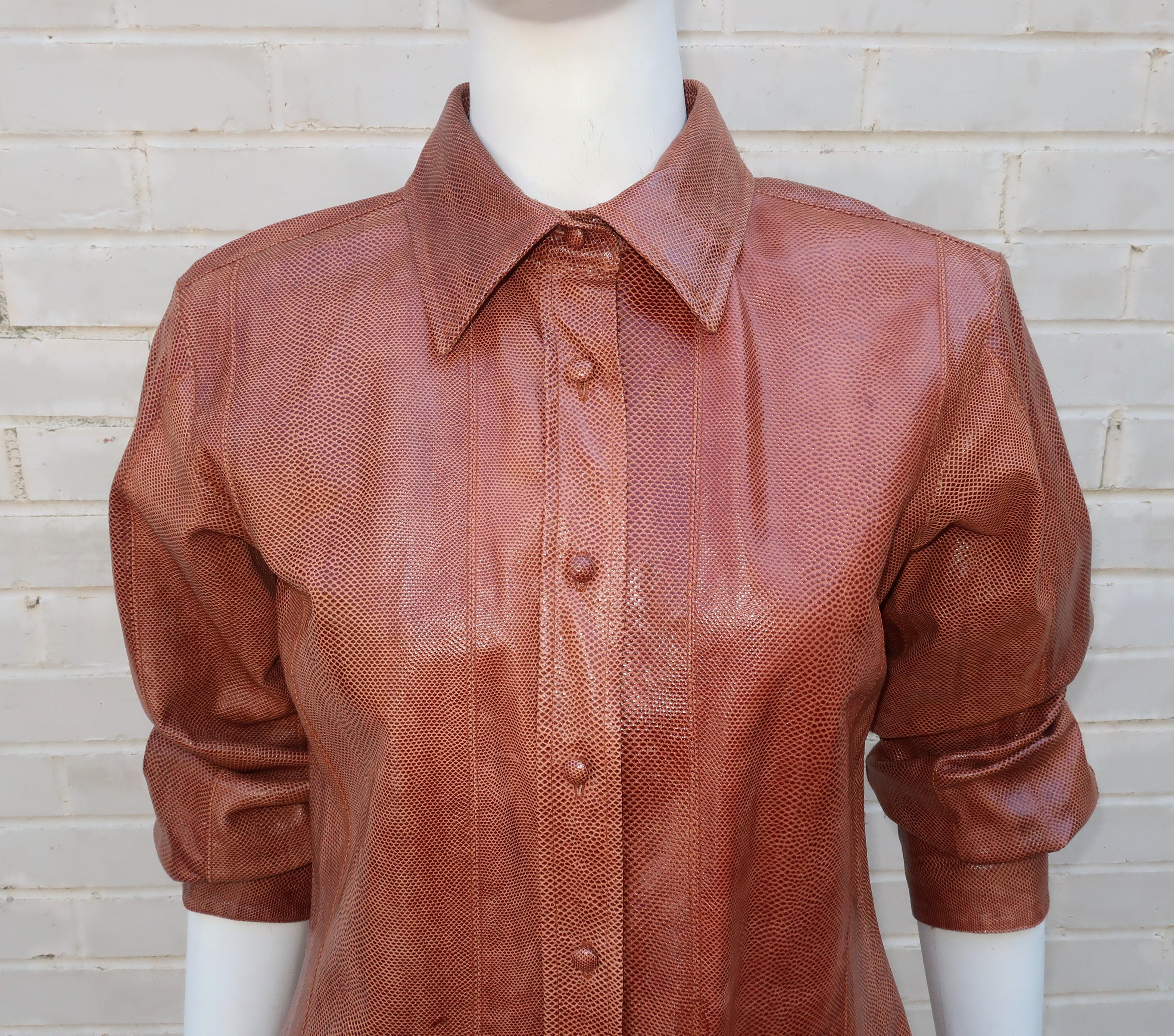 Eye catching Oscar de La Renta snakeskin top in a beautiful cognac brown with a tailored shirt style silhouette including button front, collar and cuffs.  Style this piece as a chic topper with pants and belt or go for a Western wear look with jeans