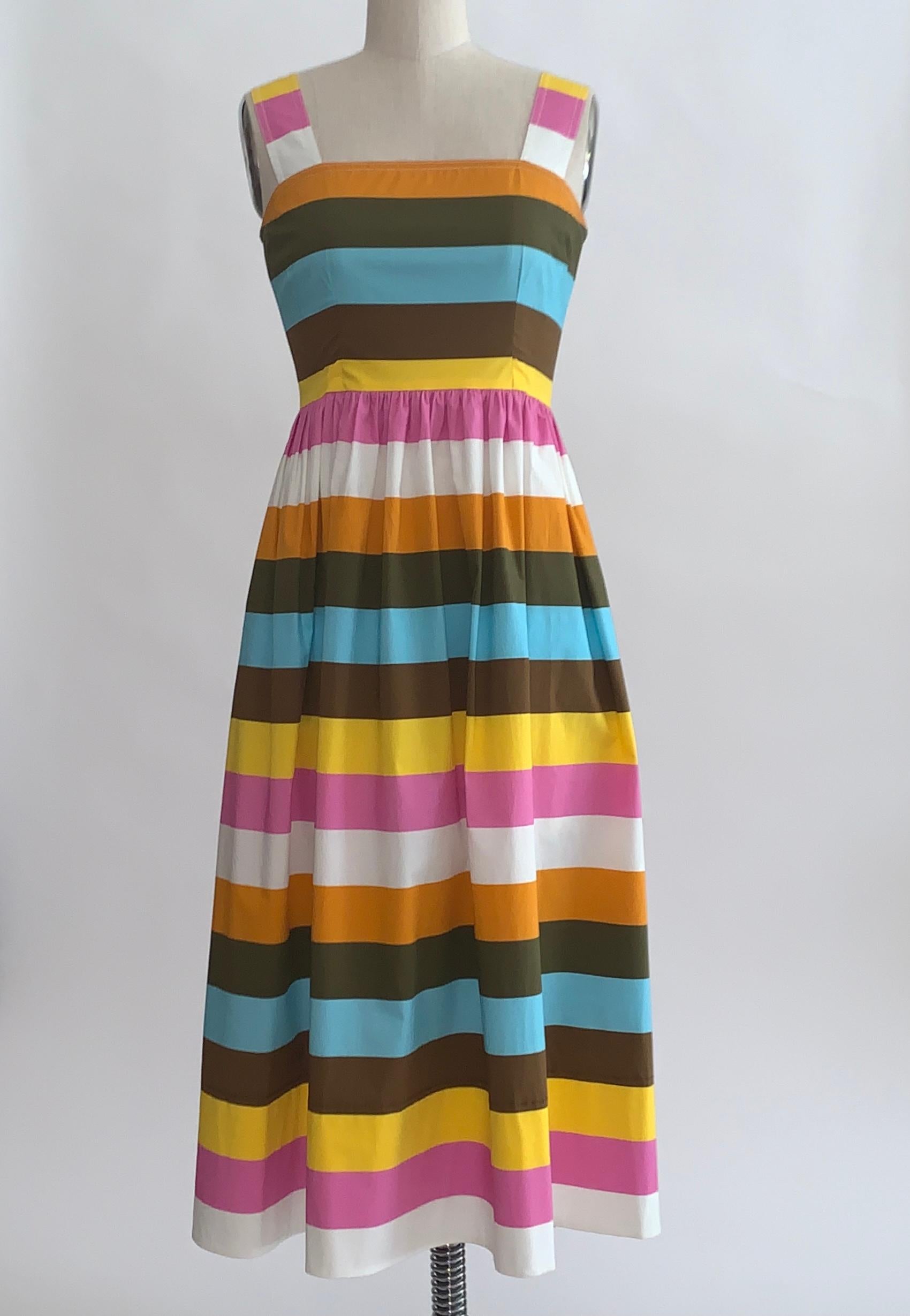 Oscar de la Renta multicolor stripe cotton sundress from the Spring 2020 collection. Wide stripes of pink, blue, white, yellow, brown, ochre and orange create a fun summery look. Hidden side pockets. Back zip.

97% cotton, 3% spandex. Unlined.

Made