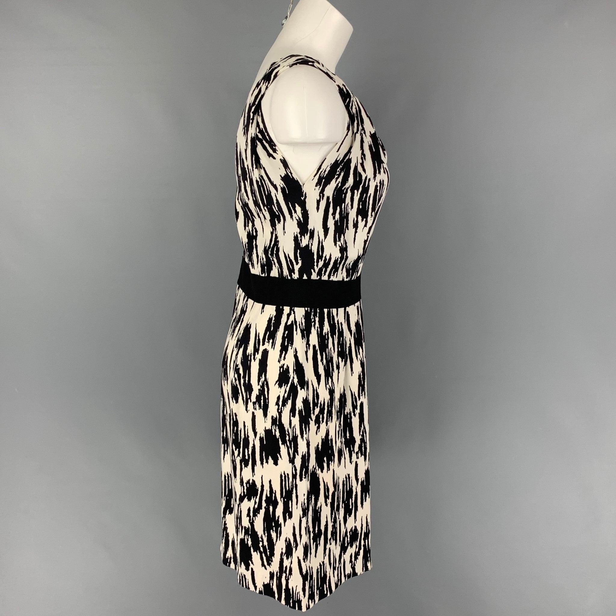 OSCAR DE LA RENTA dress comes in a black & white print silk featuring a sheath style, ribbed trim, sleeveless, and a back zip up closure. Made in Italy.
Very Good
Pre-Owned Condition. 

Marked:   10 

Measurements: 
  Bust: 30 inWaist: 28 inches 