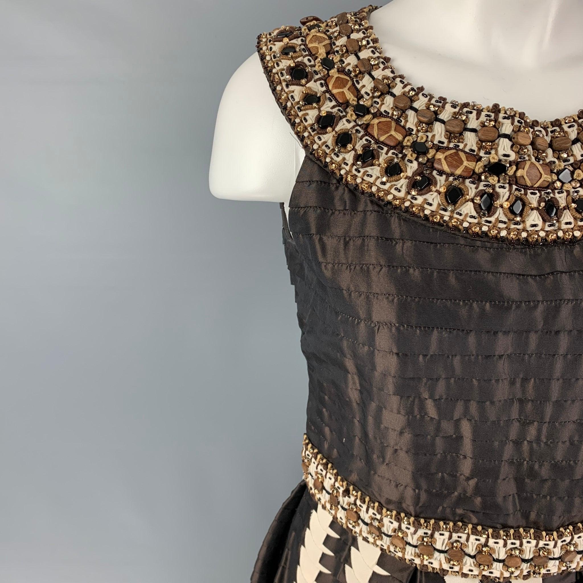 OSCAR DE LA LENTA SS2008 dress comes in a brown silk featuring a pleated style, a-line, beaded crystal embellishments, hook & loop details, anda back zipper closure. Made in USA. Very Good
Pre-Owned Condition. Light marks at front. As-Is.  

Marked: