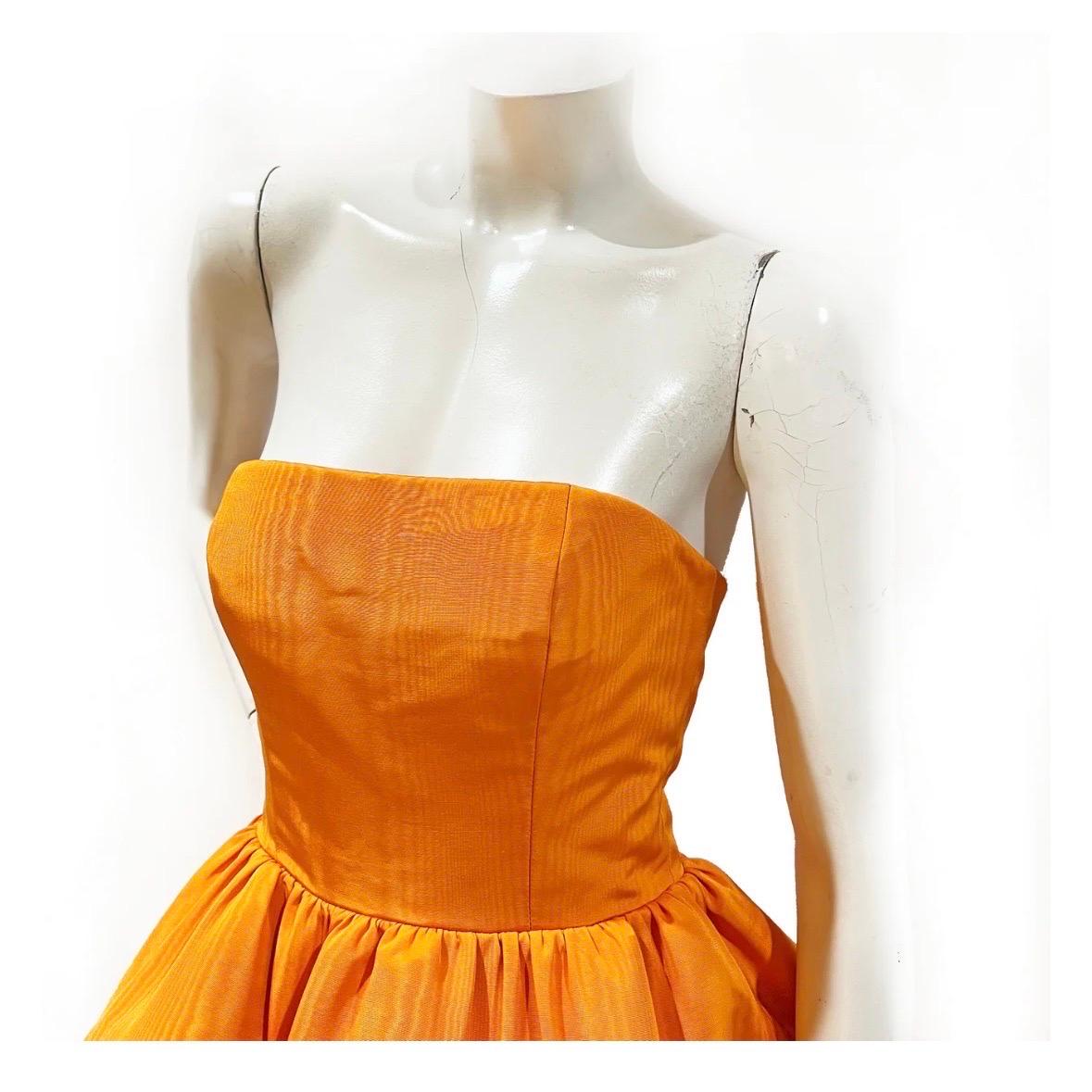 Strapless Flared Mini Dress by Oscar de la Renta 
Spring 2022 Ready-to-Wear
Made in Italy
Bright orange (
