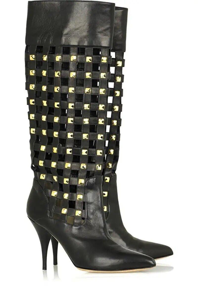 OSCAR DE LA RENTA BOOTS
Toughen up ladylike looks with Oscar de la Renta's black leather checker studded knee-high boots.
Oscar de la Renta boots have a latticed effect with gold-tone stud detailing, pointed toe, leather sole and simply pull