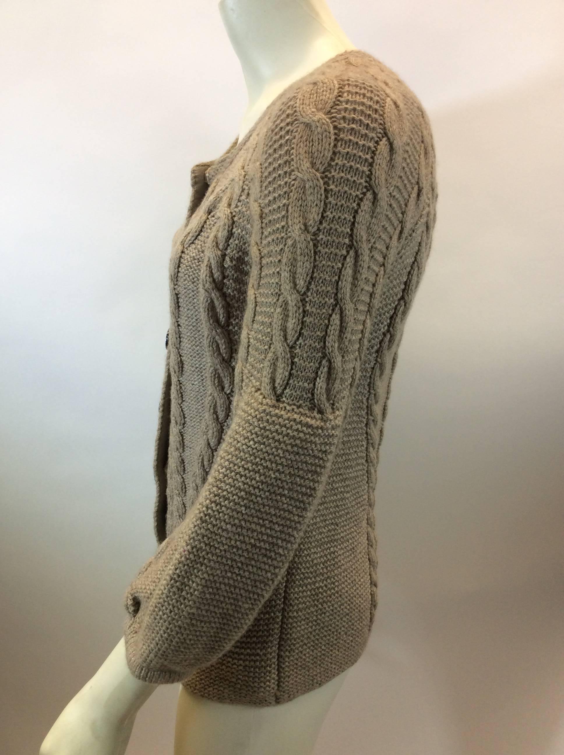 Oscar De La Renta Tan Knit Cardigan
Made in Russia
$250
100% Cashmere
Size Small
Length 23