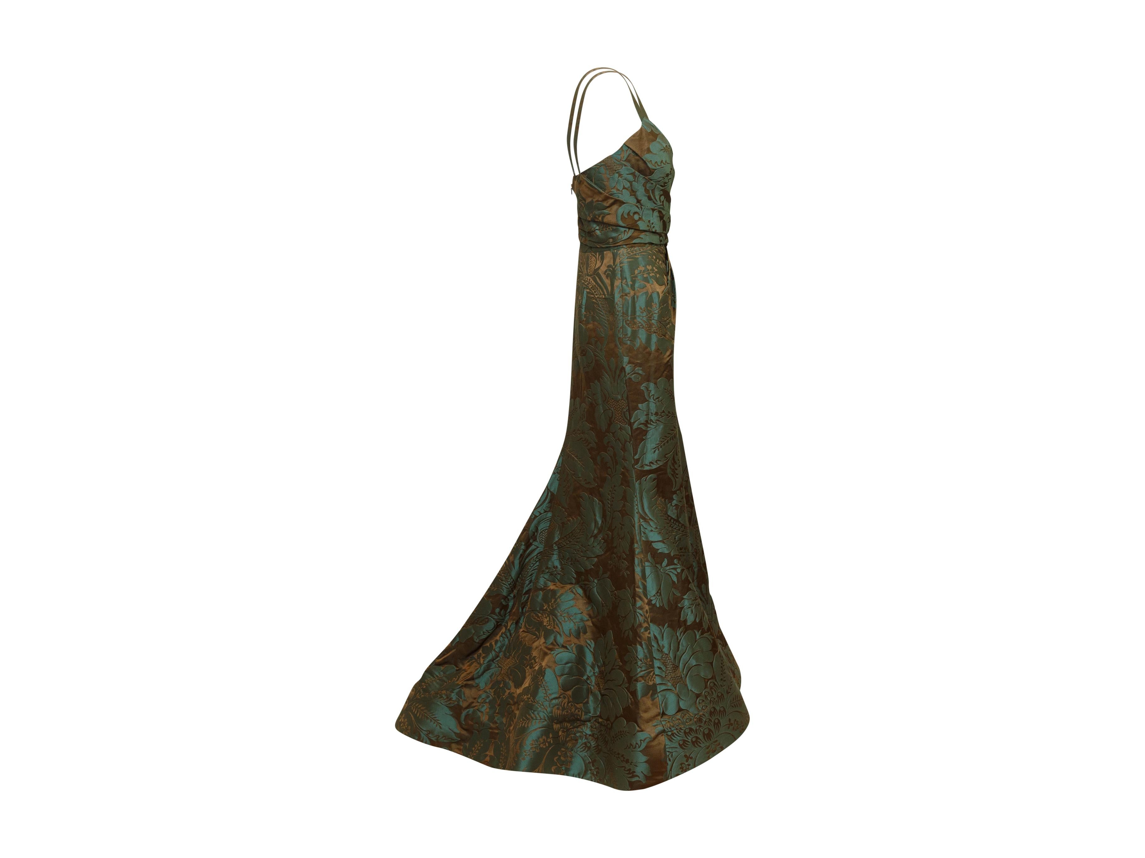 Product details: Teal and brown jacquard bustier gown by Oscar de la Renta. From the Fall 2011 Collection. Surplice neckline. Boning at interior bodice. Brocade pattern throughout. Zip closure at back. 31