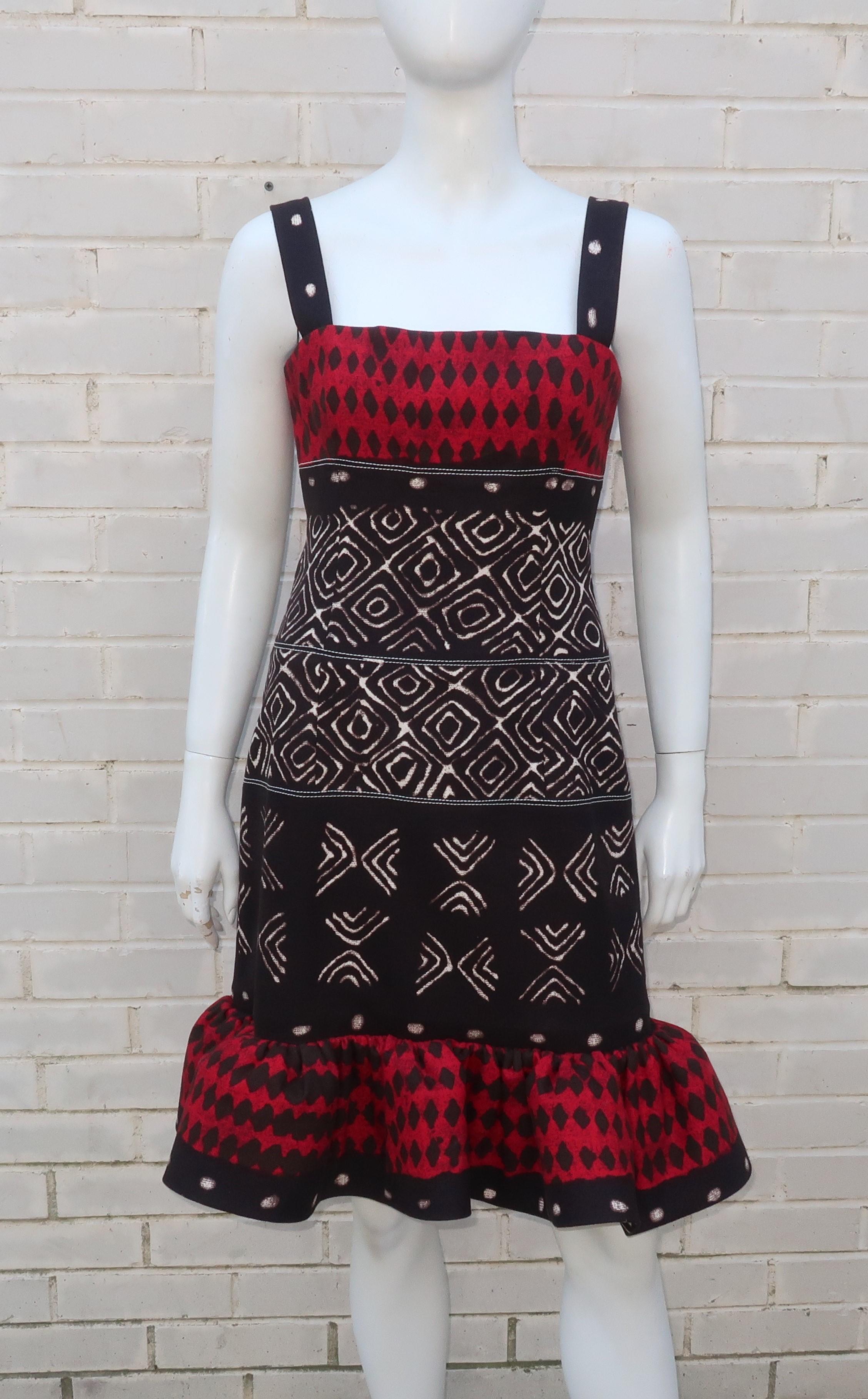 Fun and flirty with a good dose of exoticism ... this Oscar de la Renta dress has it all!  The heavy cotton tribal motif fabric has the weight and feel of upholstery which is perfect for providing just the right amount of stiffness and shape to the