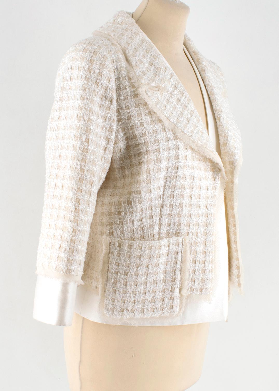 Oscar de la Renta Tweed Jacket

Ivory and creme 
Open-front tweed jacket
Structured shoulders
Two front pockets
Single slit pocket at bust
Standard notch collar and lapels
Long sleeves
Raw edge trim
Lightweight

Please note, these items are