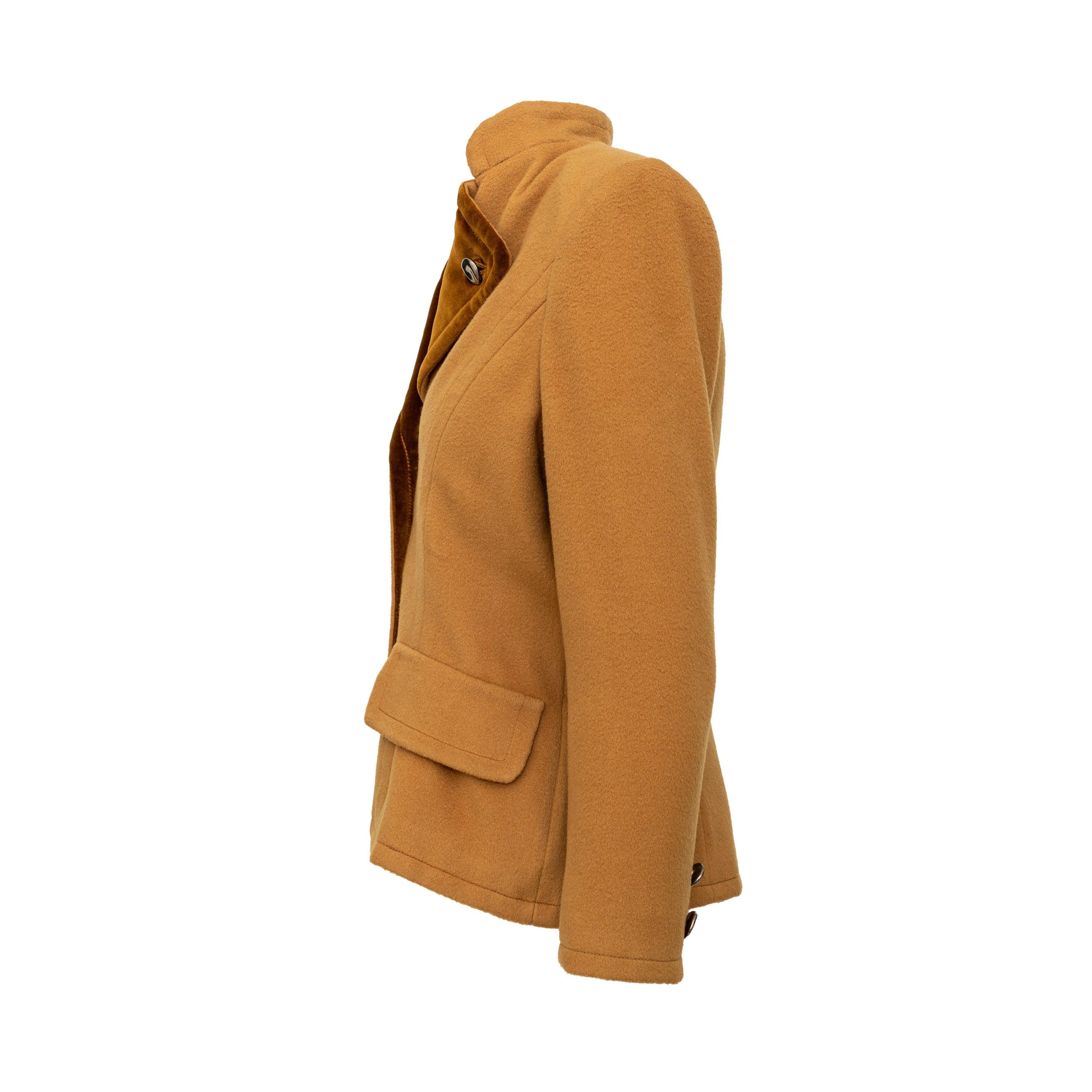 Introducing the Oscar de la Renta Velvet Collar Wool Jacket from the 90s. Made from a soft wool blend in a rich brown color, this jacket features a unique folded velvet collar that adds a touch of elegance to your look. Complete with front buttons