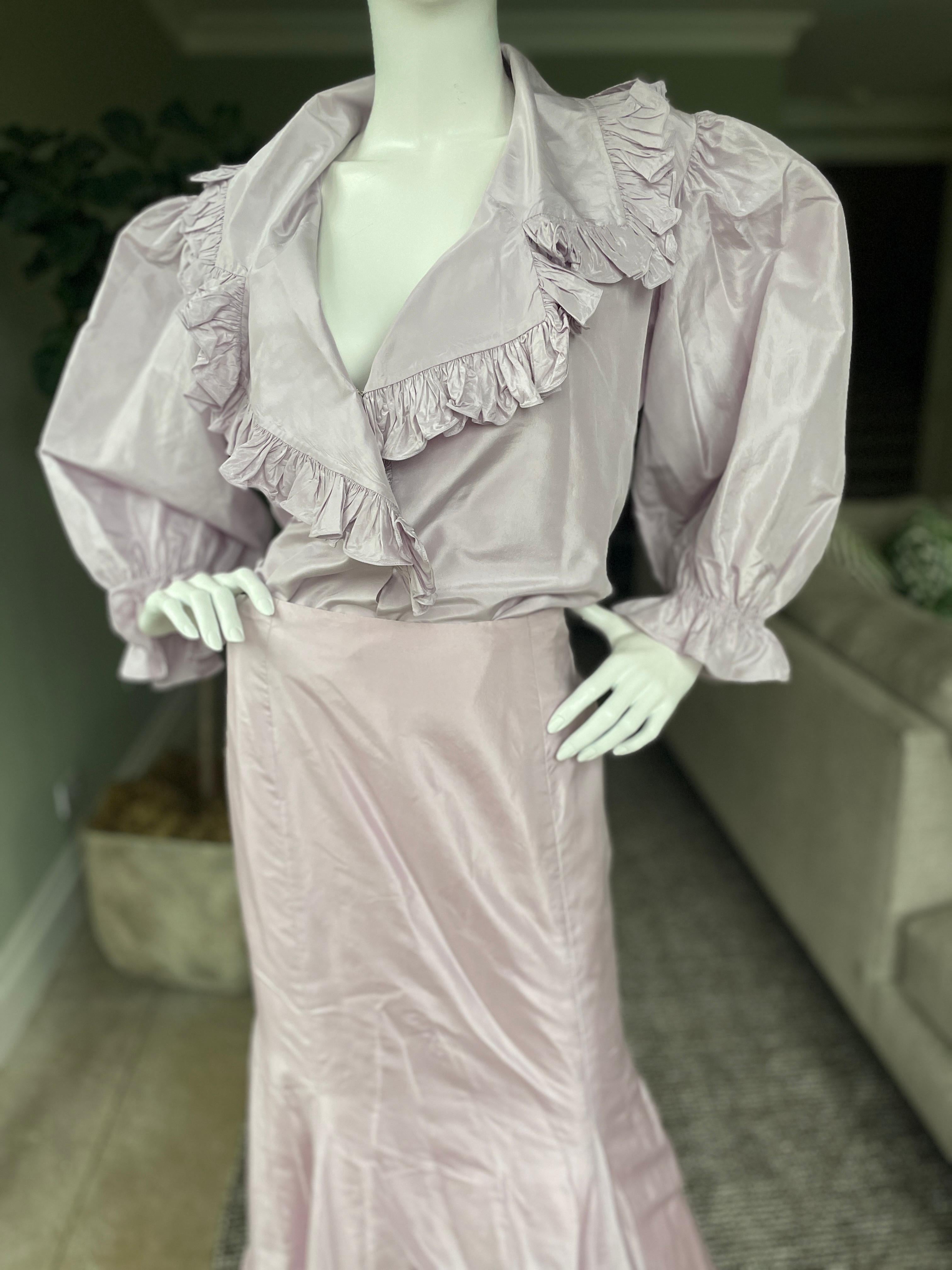 Oscar de la Renta Vintage 80's Mauve Silk Taffeta 2 Pc Evening Dress
Featuring a long sleeve top with ruffles and a ball skirt with fishtail back and ruffled hem.
It is much more purple ping than the colors show, most accurate in the skirt