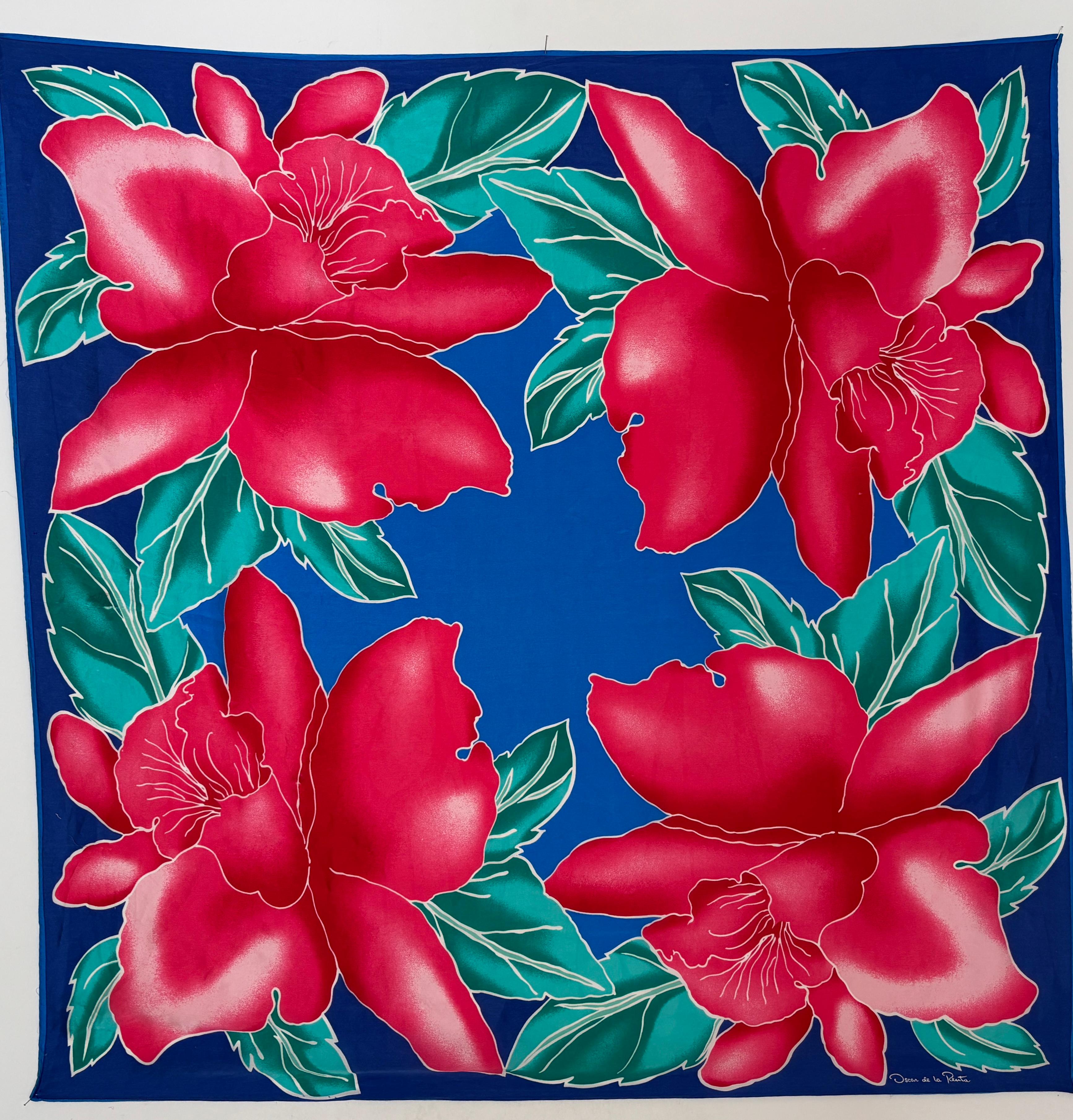 Oscar De La Renta wonderfully vivid floral tropical silk scarf.
This vintage Oscar De La Renta silk scarf measures 34 inches by 34 inches, with hand-rolled edges. 
Great to use as a wrap on the beach or around the pool.
Green blue and pink bold