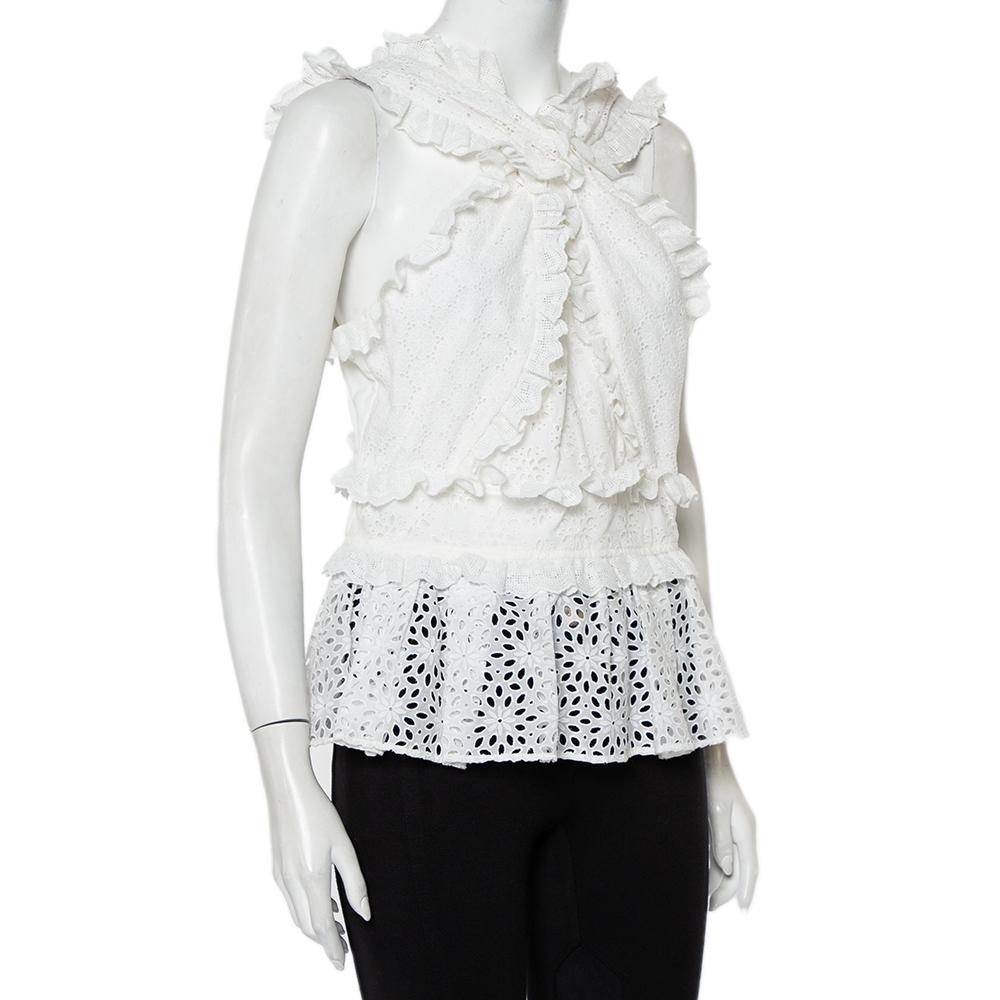 Perfect for summers, this peplum top channels the romantic aesthetic Oscar de la Renta is so popular for. It has been crafted from delicate white lace and styled with ruffle detailing. The sleeveless top has a draped silhouette and a flattering