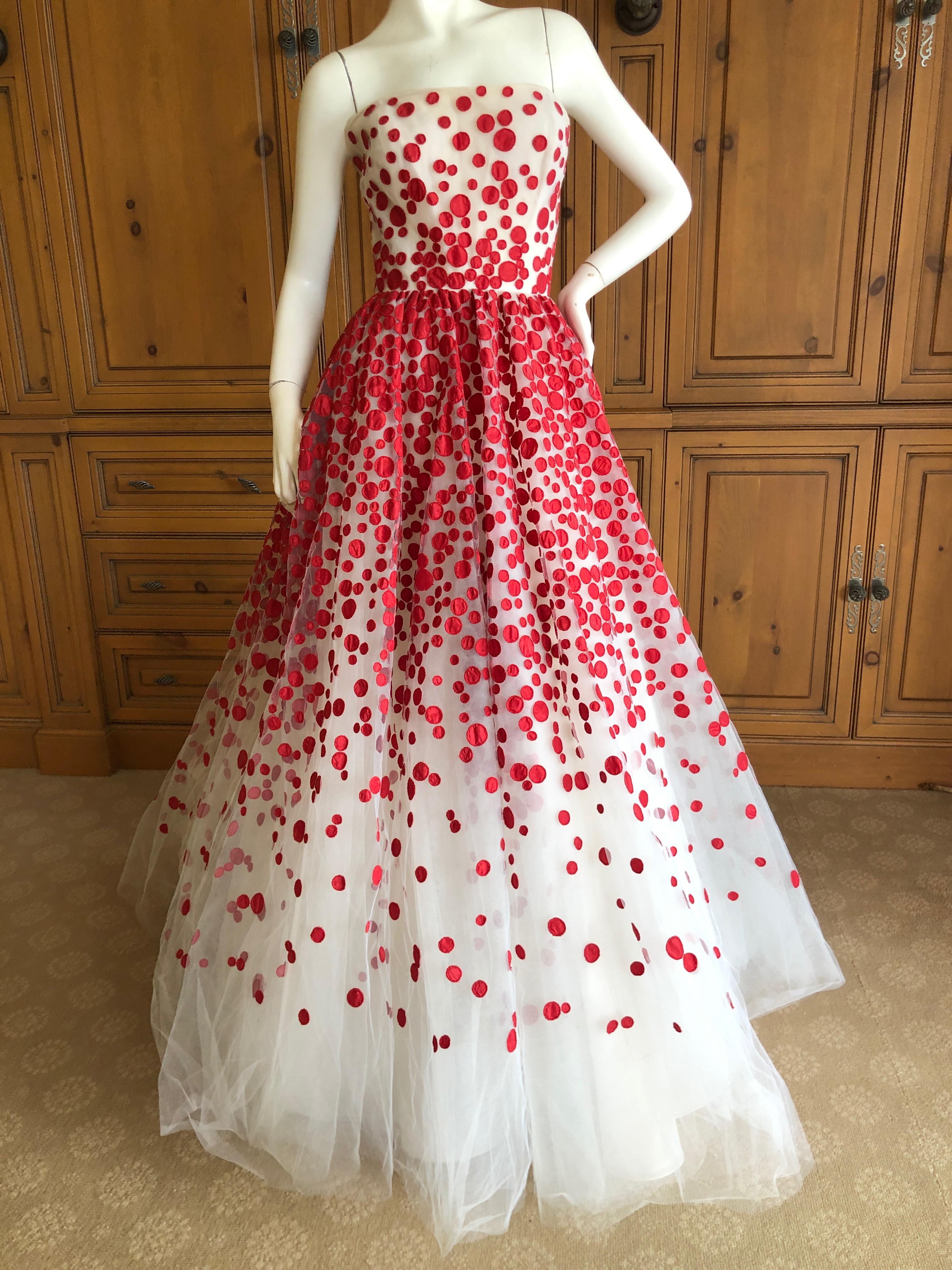 Oscar de la Renta Romantic Red Dot Strapless Tulle Ball Gown 
There is an inner bustier.  Simply Stunning. 
Please use the zoom feature to see al the remarkable details.
 Four layers of skirts 
Size 12
 Bust 36
