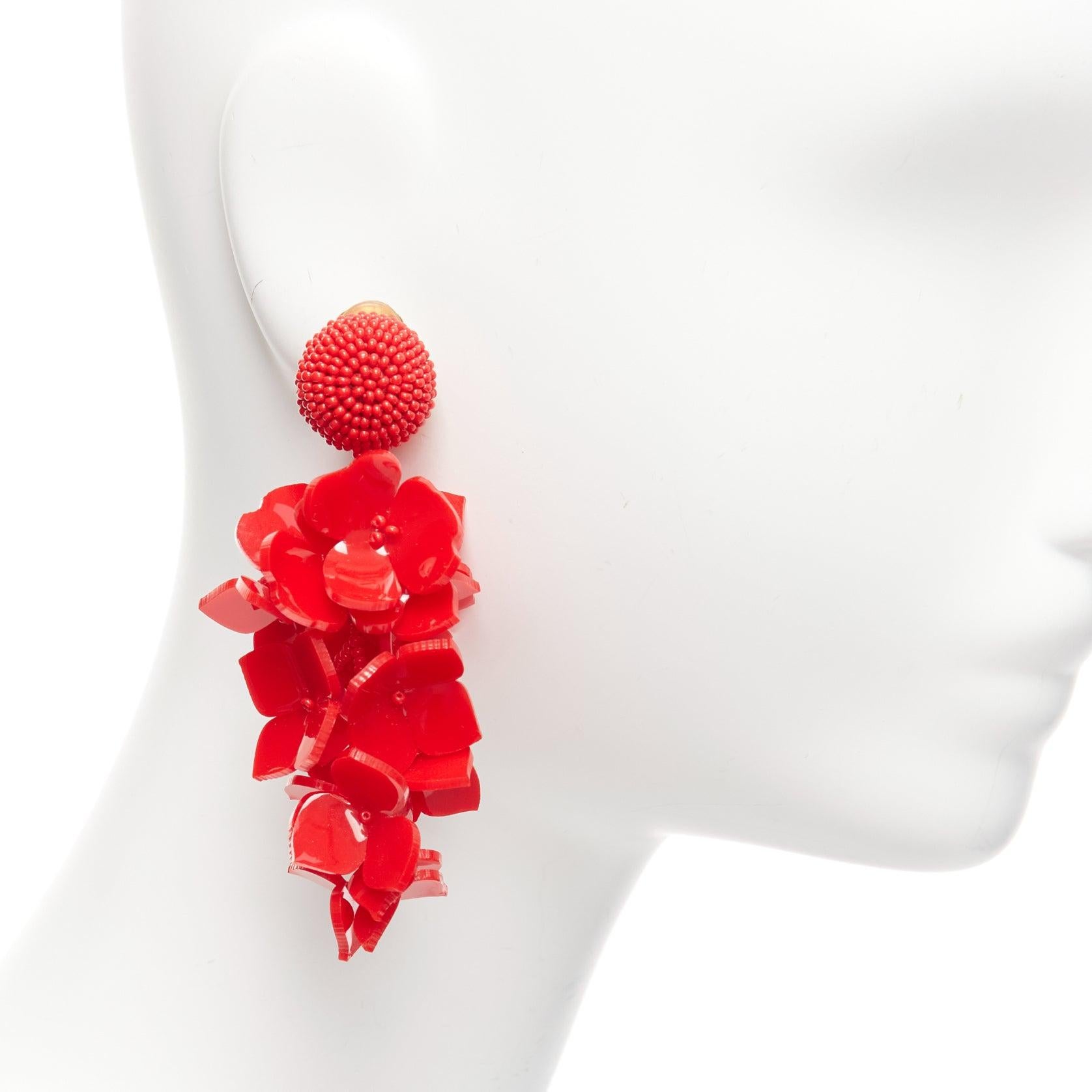 OSCAR DE LA RENTA red acrylic Wisteria flower petals beaded dangling clip on earrings pair
Reference: AAWC/A00912
Brand: Oscar de la Renta
Material: Acrylic, Metal
Color: Red, Gold
Pattern: Solid
Closure: Clip On
Lining: Gold Metal
Made in: