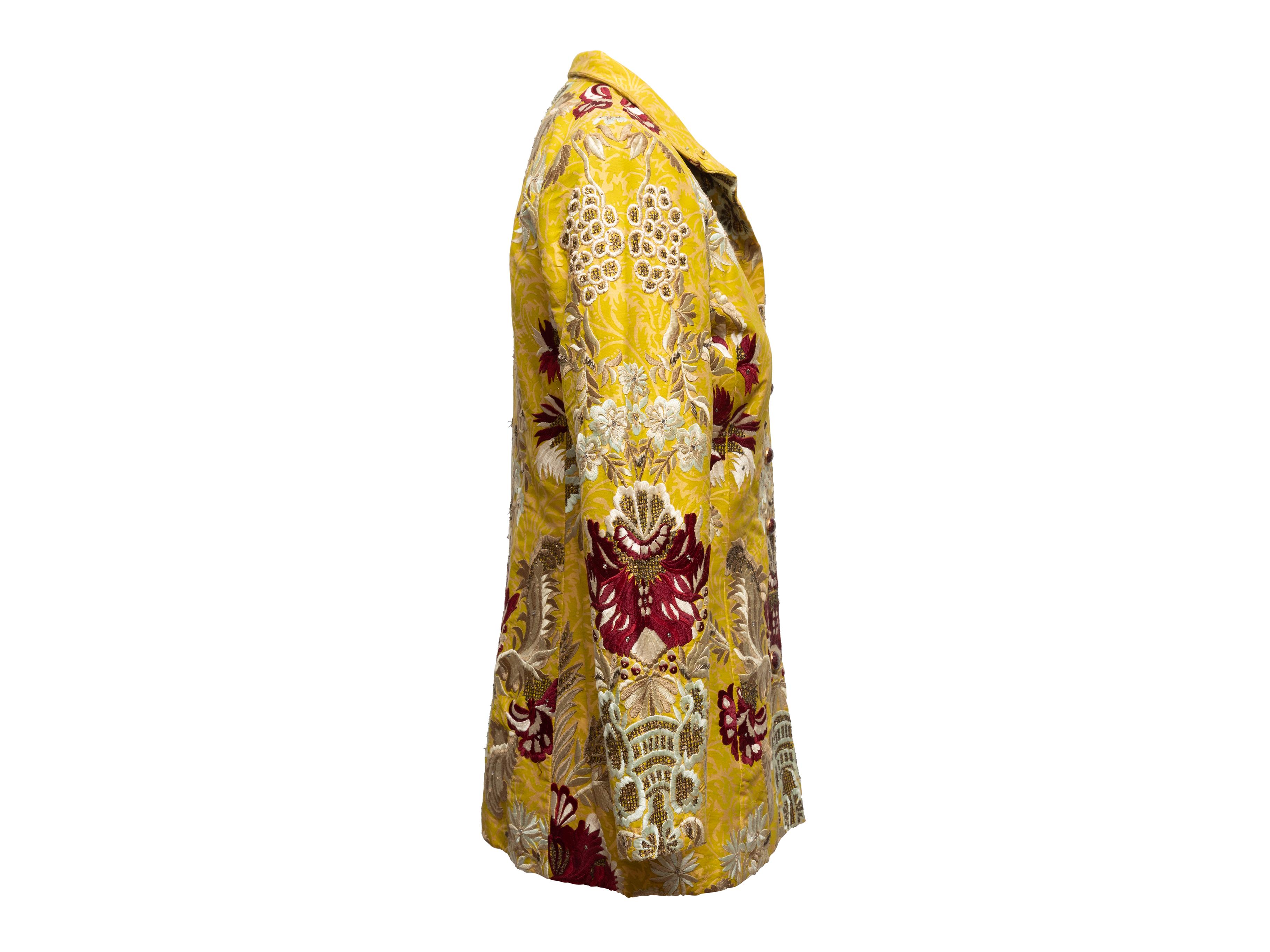 Product Details: Yellow and multicolor embroidered jacket by Oscar de la Renta. Circa 2003. Pointed collar. Beaded floral embroidery throughout. Button closures at center front. Designer size 4. 34