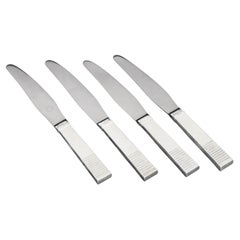 Oscar Gundlach-Pedersen for Georg Jensen. Four "Parallel" lunch knives.