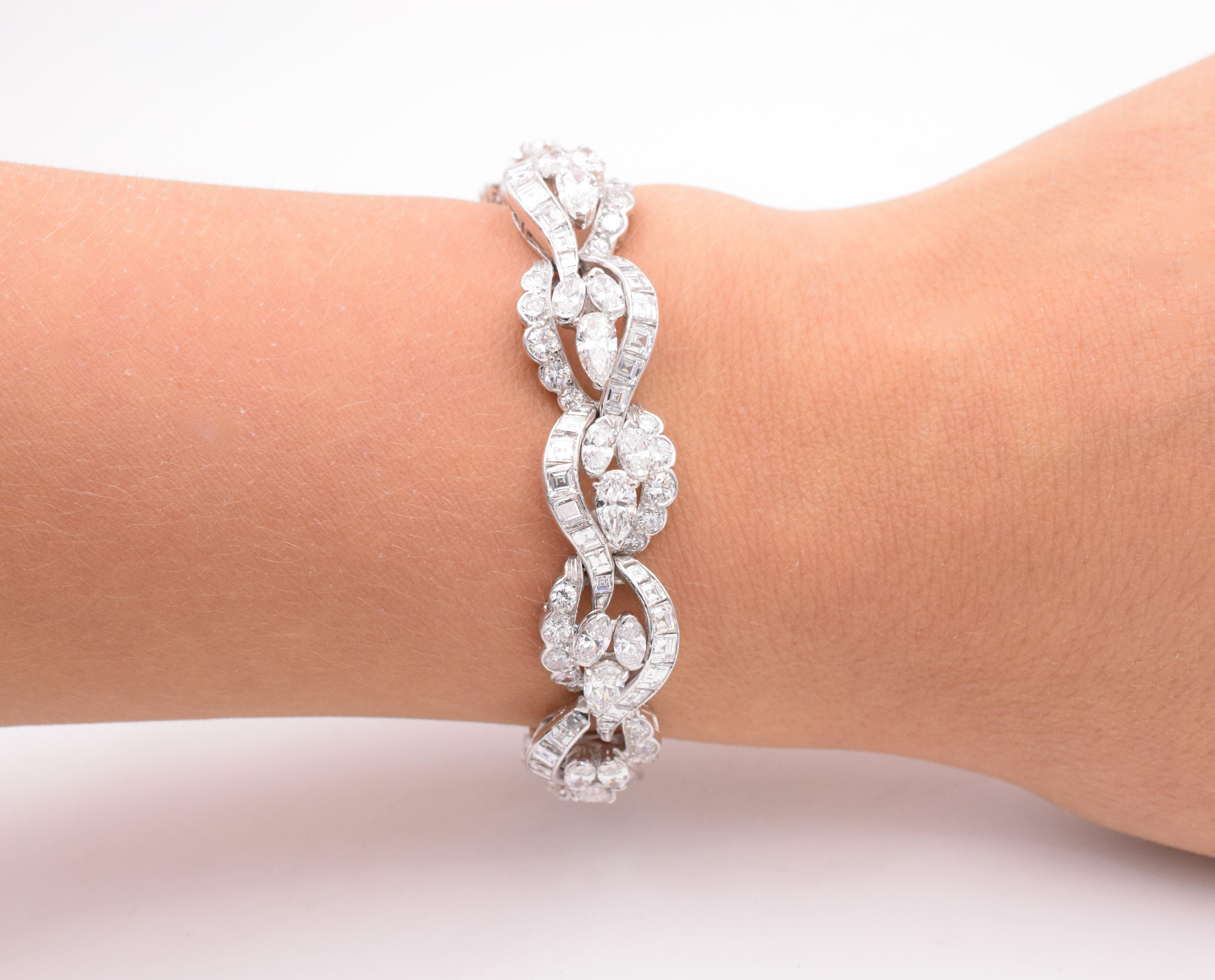 Oscar Heyman & Brothers Diamond Bracelet This bracelet has circular, pear, marquise, baguette and tapered baguette- cut diamonds all set in platinum. circa 1960, Length: 6.5 inches Weight: XX g. Comes with a Oscar Heyman Certificate of Authenticity