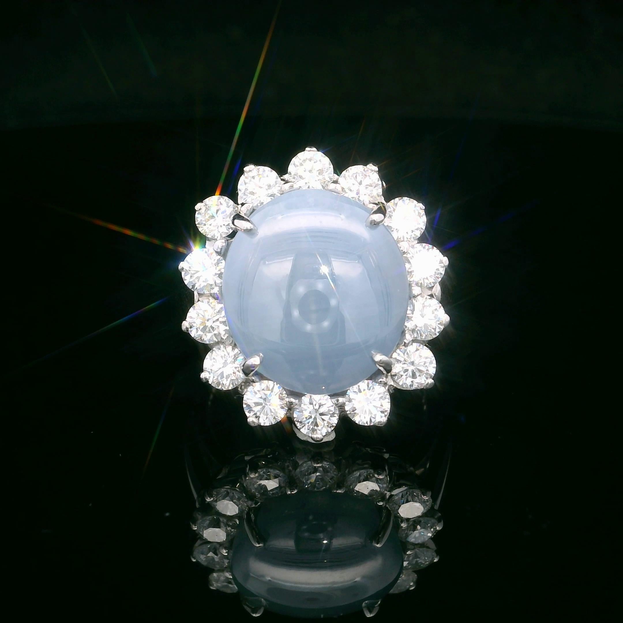 This Oscar Heyman ring is made from platinum and contains a rare 14.21ct Cat's-Eye Sapphire and 14 colorless round diamonds weighing 1.48cts. Cat's-eye sapphires display the phenomenon of chatoyancy - a light reflecting phenomenon where a line