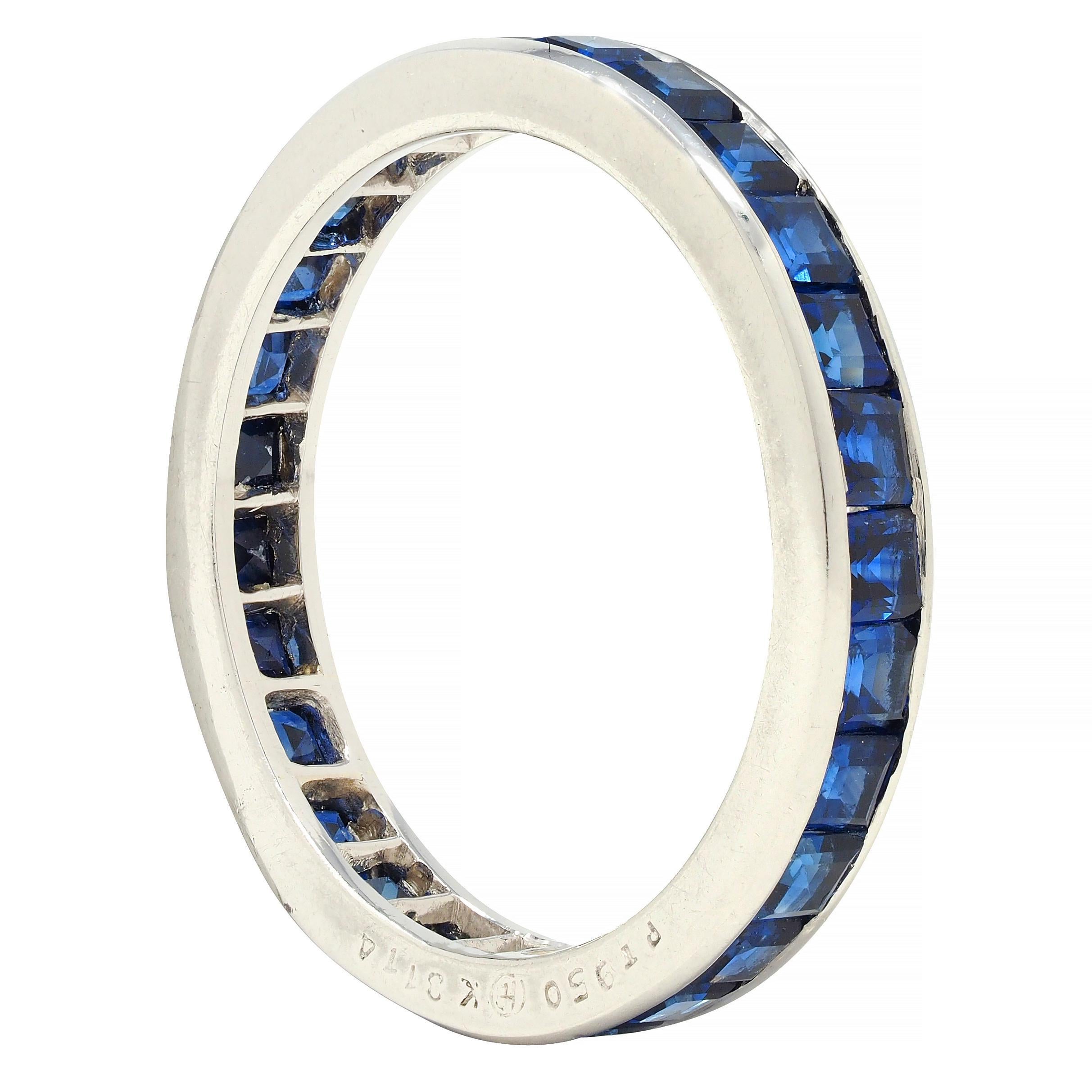 Comprised of step-cut sapphires channel set fully around 
Weighing approximately 1.89 carats total 
Transparent medium blue in color
Stamped for platinum
Numbered with maker's mark for Oscar Heyman
Circa: 1960s
Ring size: 5 3/4 and not