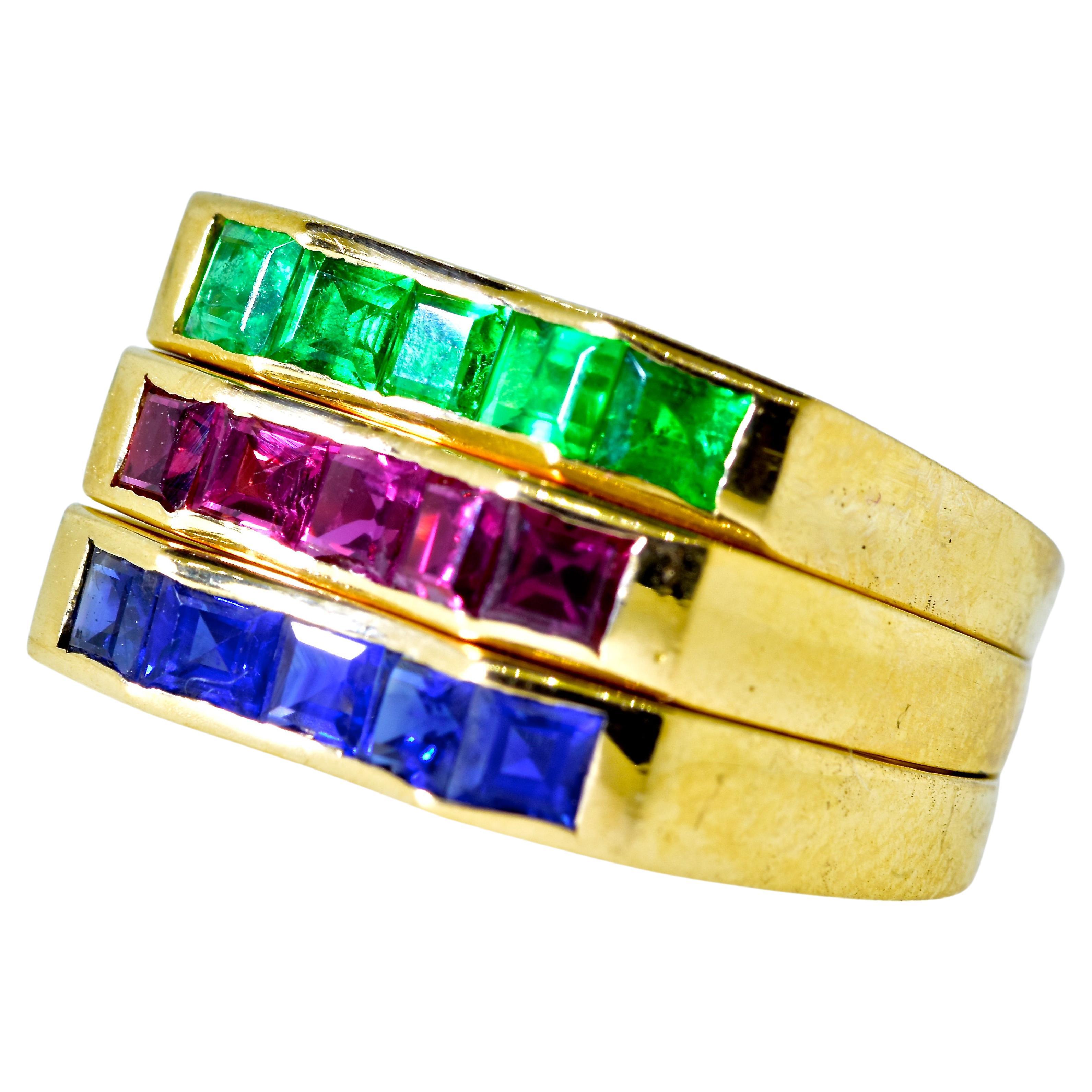 Oscar Heyman 18K yellow gold rings with very fine fancy cut natural Ruby, Sapphire and Emerald.  All of these natural stones are of the finest quality,  The Ruby band possesses 5 square cut natural rubies estimated to weigh .80 cts., the Sapphire