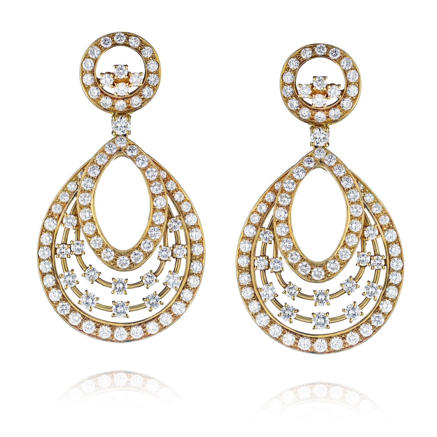13 Carat Round Cut Diamond Dangling Earrings. 

Talk about a wow factor! These magnificent snowflake-style diamond dangling earrings by Oscar Heyman are certainly a show stopper!

Mounted in 18k yellow gold with 13 carats of diamonds these earrings