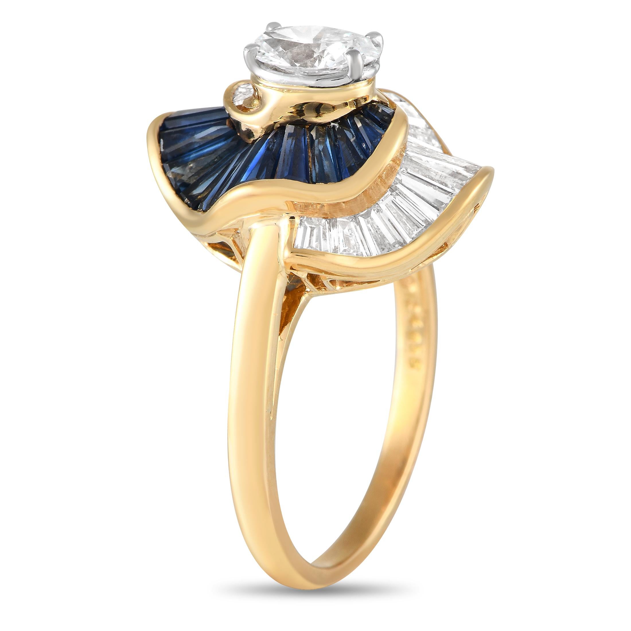 A dynamic design beautifully showcases the stunning array of gemstones present on this Oscar Heyman ring. The 0.55 carat oval-cut diamond center stone serves as a stunning focal point, while additional baguette diamonds totaling 1.23 carats and