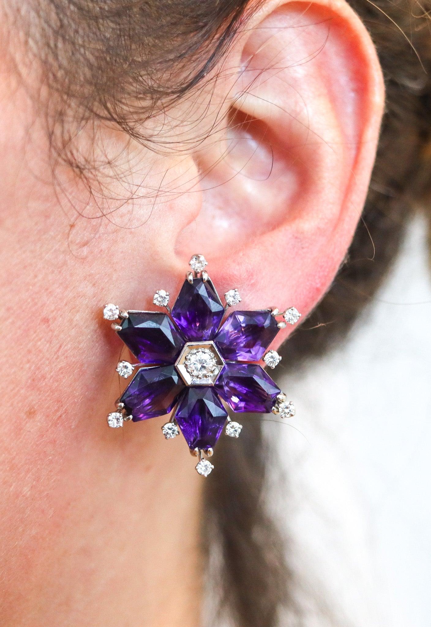 Convertible dress-clips clips-on earrings designed by Oscar Heyman.

This is an exceptional pair of convertible dress-clips and clips-on earrings created in New York by the jewelry house of the Oscar Heyman Brothers. This pair was designed as spiky