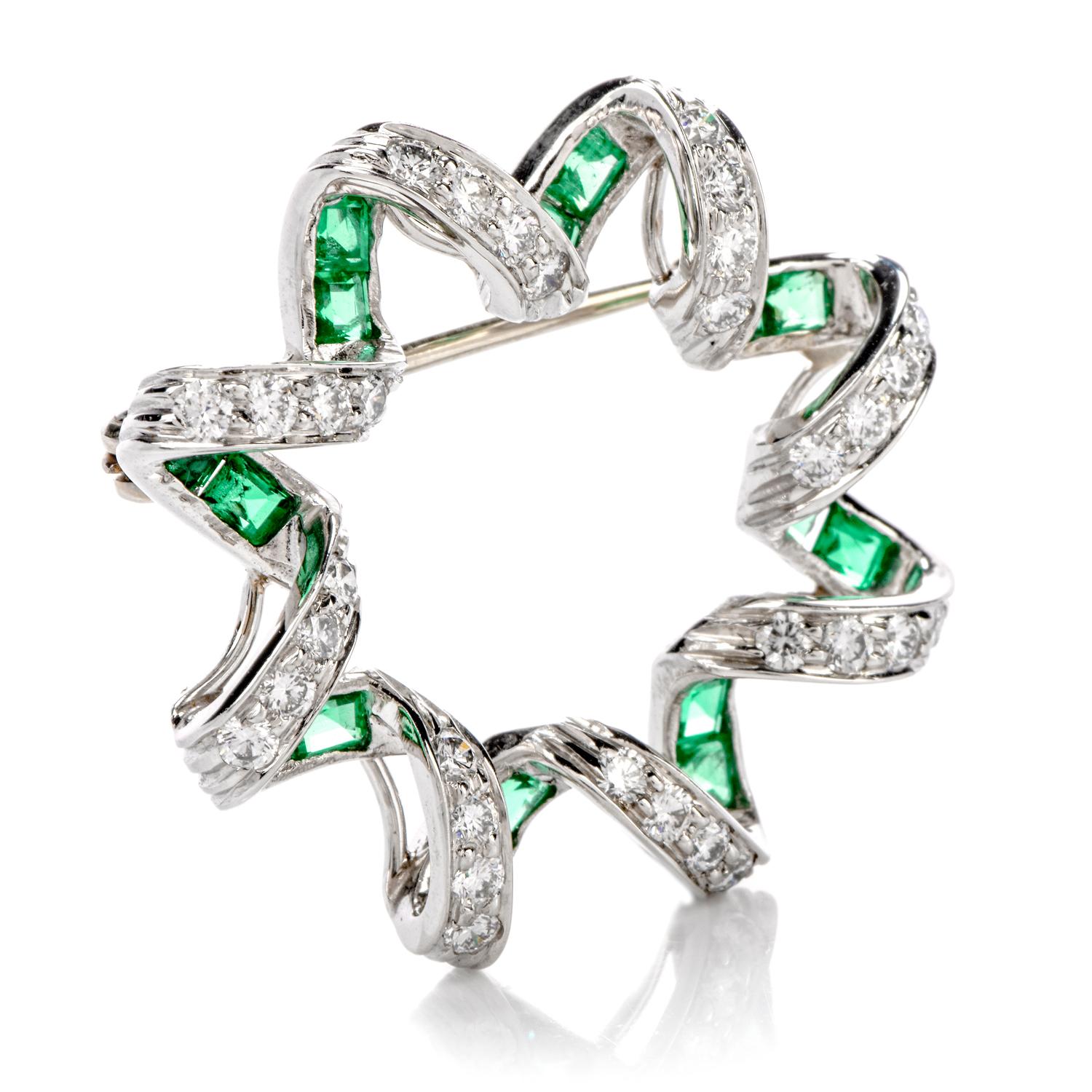 This rolling and twisted brooch was inspired in a Star

motif and crafted in luxurious Platinum.

With diamonds flowing over the top and emeralds shadowing below, the billowing

design boasts with contrasting colors.

32 Diamonds cumulatively weigh
