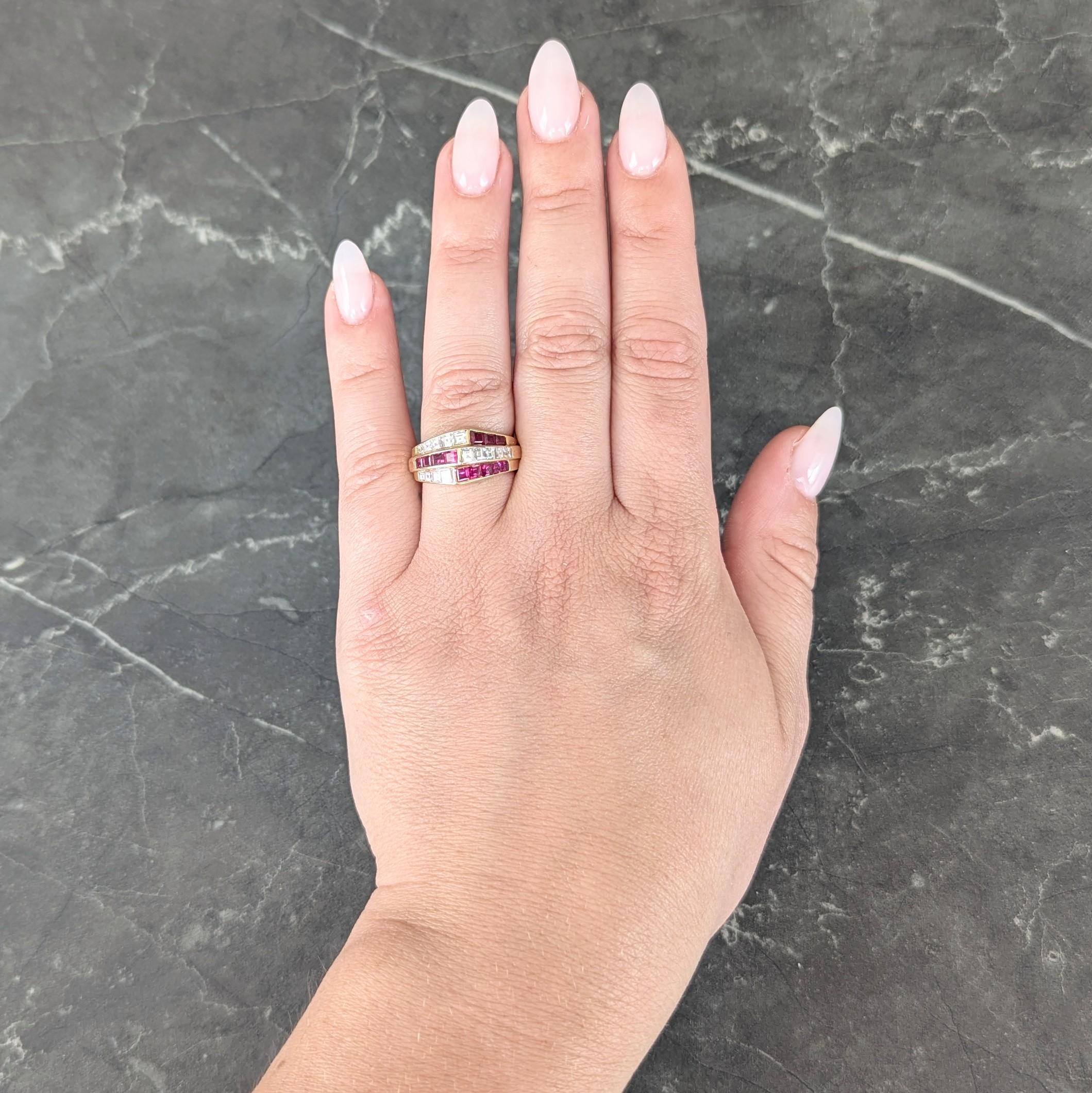 Wide band centers split rows of channel set diamonds and rubies arranged as pointed form
Diamonds weigh approximately 1.07 carats total - G color with VS2 clarity
Sapphires weigh approximately 1.09 carats total - transparent medium red
With high