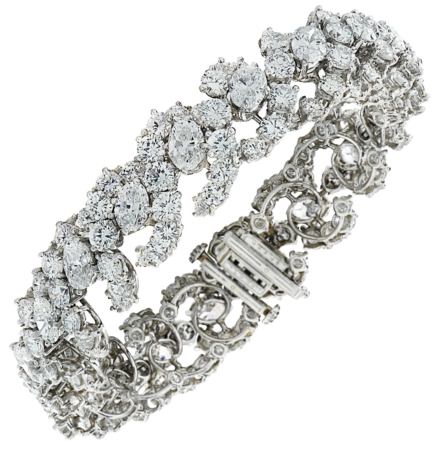 Sensational Oscar Heyman diamond bracelet circa 1963, finely crafted in platinum, featuring 19 Oval cut diamonds weighing 8.37 carats total, F-G color, VS clarity, 171 round brilliant cut diamonds weighing approximately 21.04 carats total, F-G