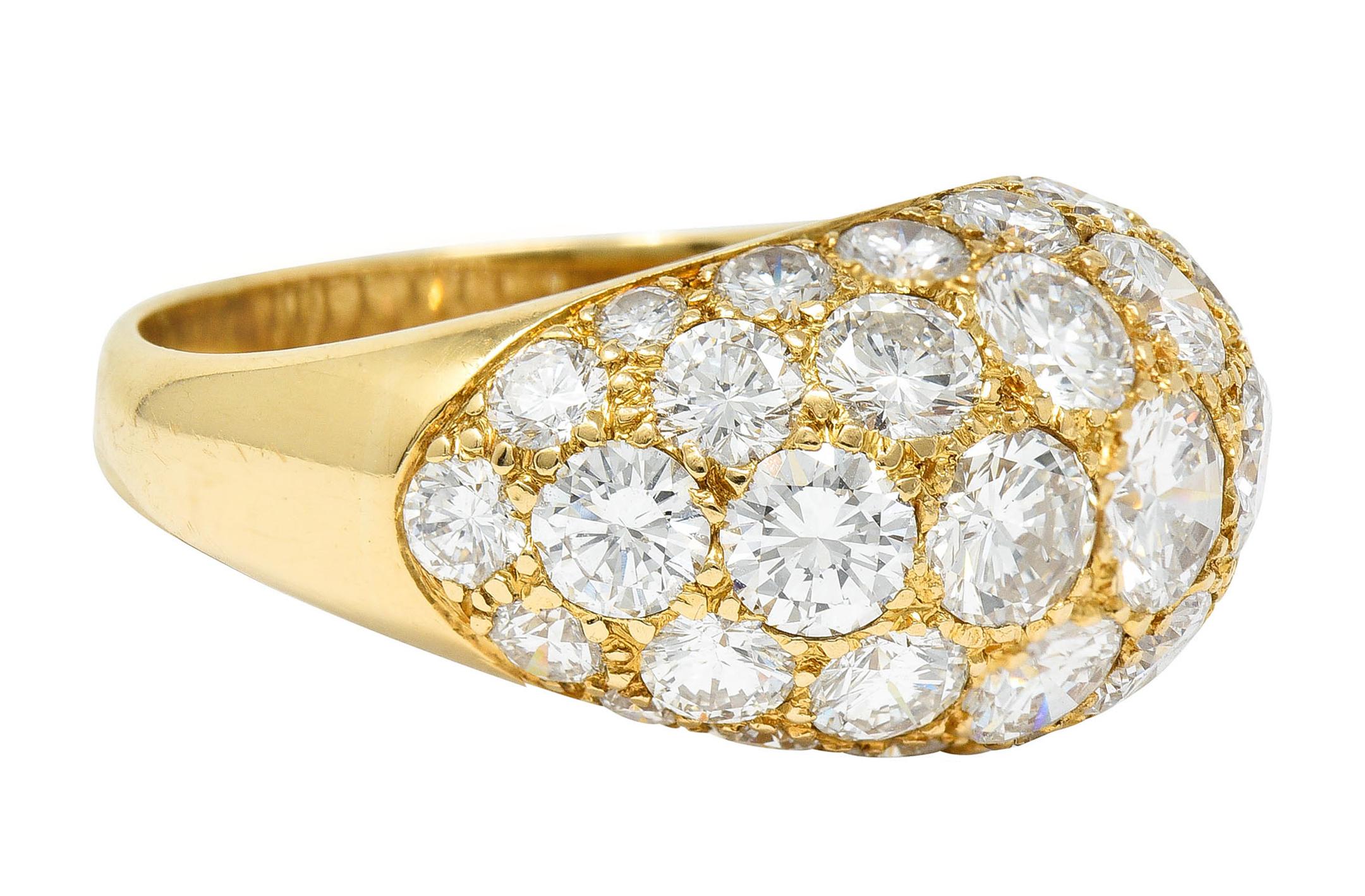 Domed bombè style band is pavè set to front with round brilliant cut diamonds

Graduating in size while weighing in total approximately 7.50 carats - G to I color with VS clarity

Stamped 18K for 18 karat gold

Numbered with maker's mark for Oscar