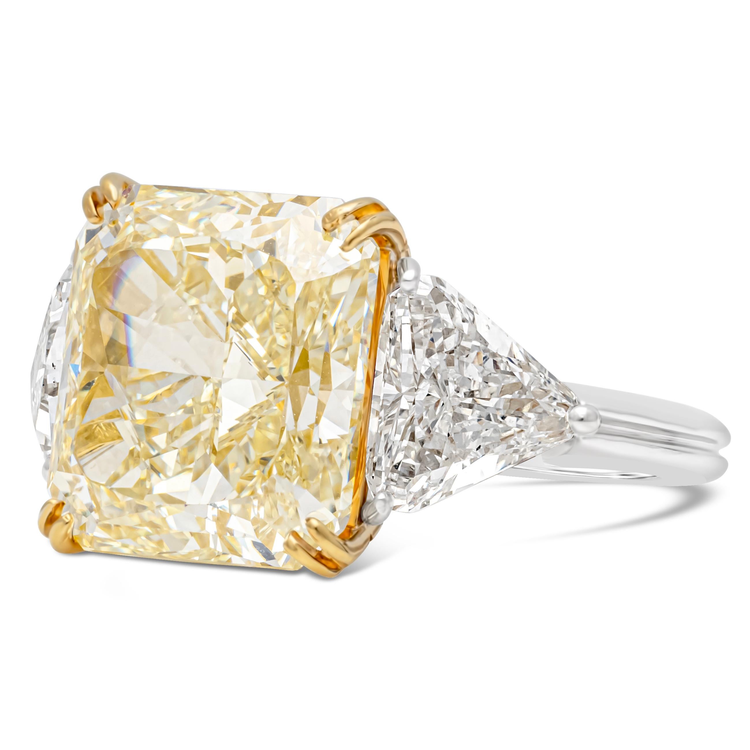 A color-rich three-stone engagement ring created by Oscar Heyman, featuring a 9.03 carats radiant cut diamond certified by GIA as Fancy Yellow color and VVS1 clarity. Set on a classic eight prong 18K yellow gold basket setting and flanked by