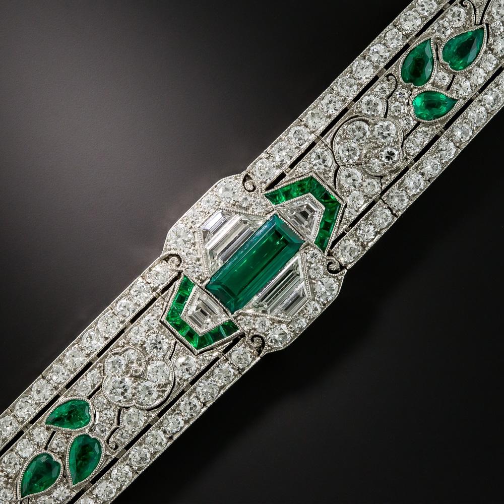 Behold the crème de la crème of Art Deco bracelets! Few, if any, original Art Deco delicacies rival this stunning exemplar of 1920's vintage jewelry quality and virtuosity. Beginning with an absolute gem 1 carat emerald in the center, this wearable