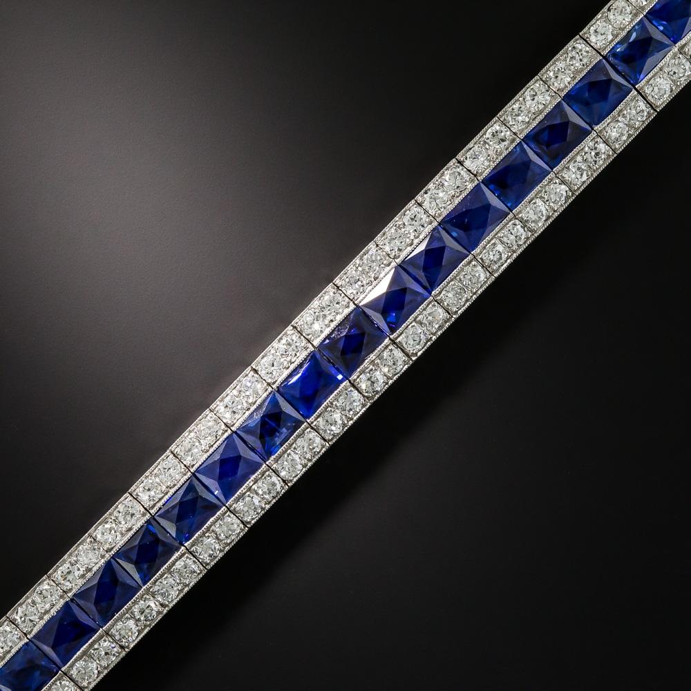 A gemmy Art Deco delicacy by the famed American jeweler - Oscar Heyman, circa 1920. A central row of 39 vibrant royal blue, scissor-cut sapphires (the finest color imaginable), totaling 20 carats, are bordered on each side by small sparkling white