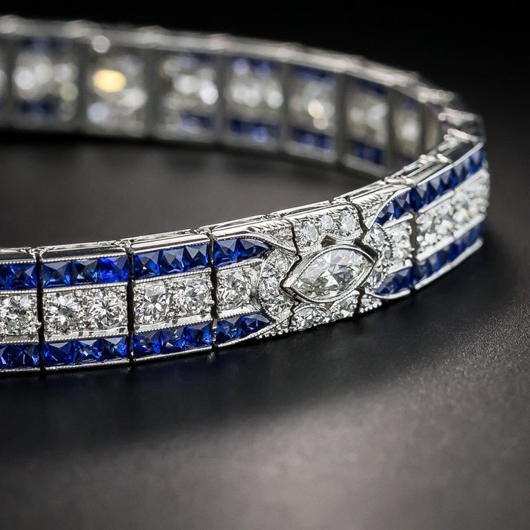 Few original Art Deco delights come as fine and fabulous as this streamlined sparkler by the renowned American manufacturer of superior jewels - Oscar Heyman Bros. The central straight row diamond center section is punctuated three times by marquise