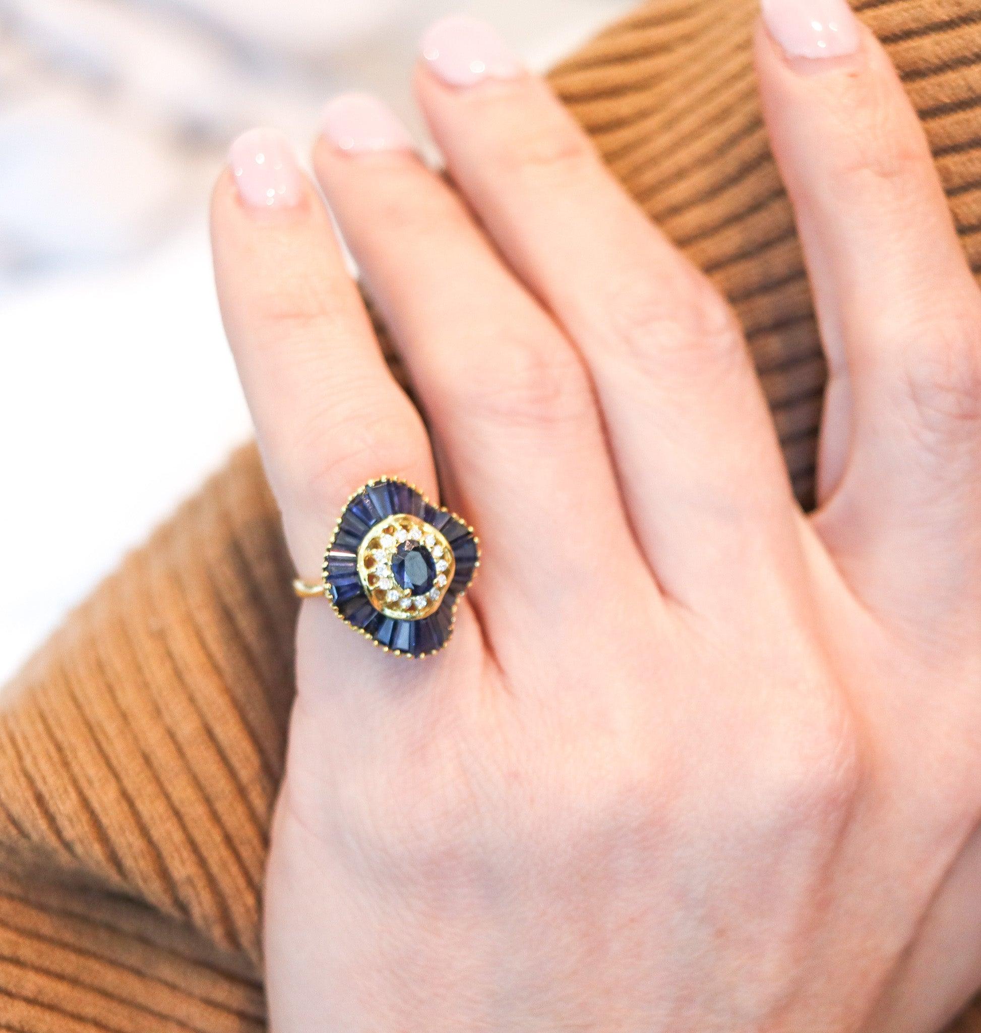 Ballerina cocktail ring designed by the Oscar Heyman Brothers.

This is a gorgeous ballerina cocktail ring, created in New York city by the iconic jewelry makers of Oscar Heyman Company. The colorful ring has been masterfully crafted in solid yellow