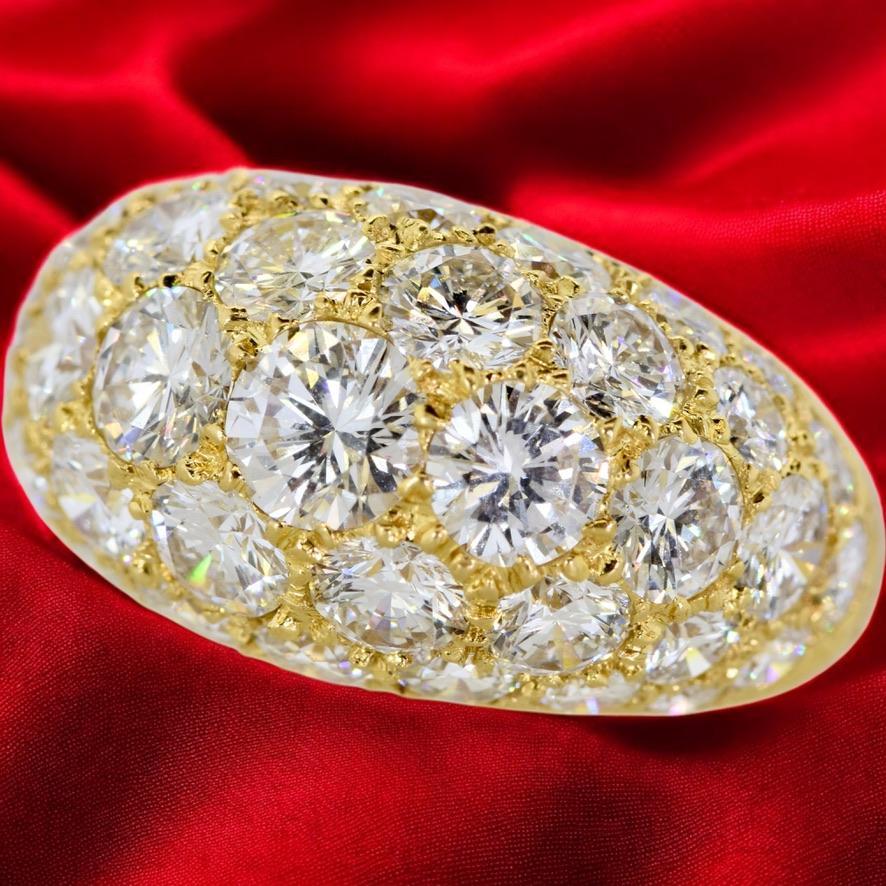 Oscar Heyman & Bros. 18K yellow gold and fine white brilliant cut diamond vintage ring. 39 very fine white diamonds are well cut and finely matched, and pave set in a slight bombe motif of this well made ring by this American master jewelry designer