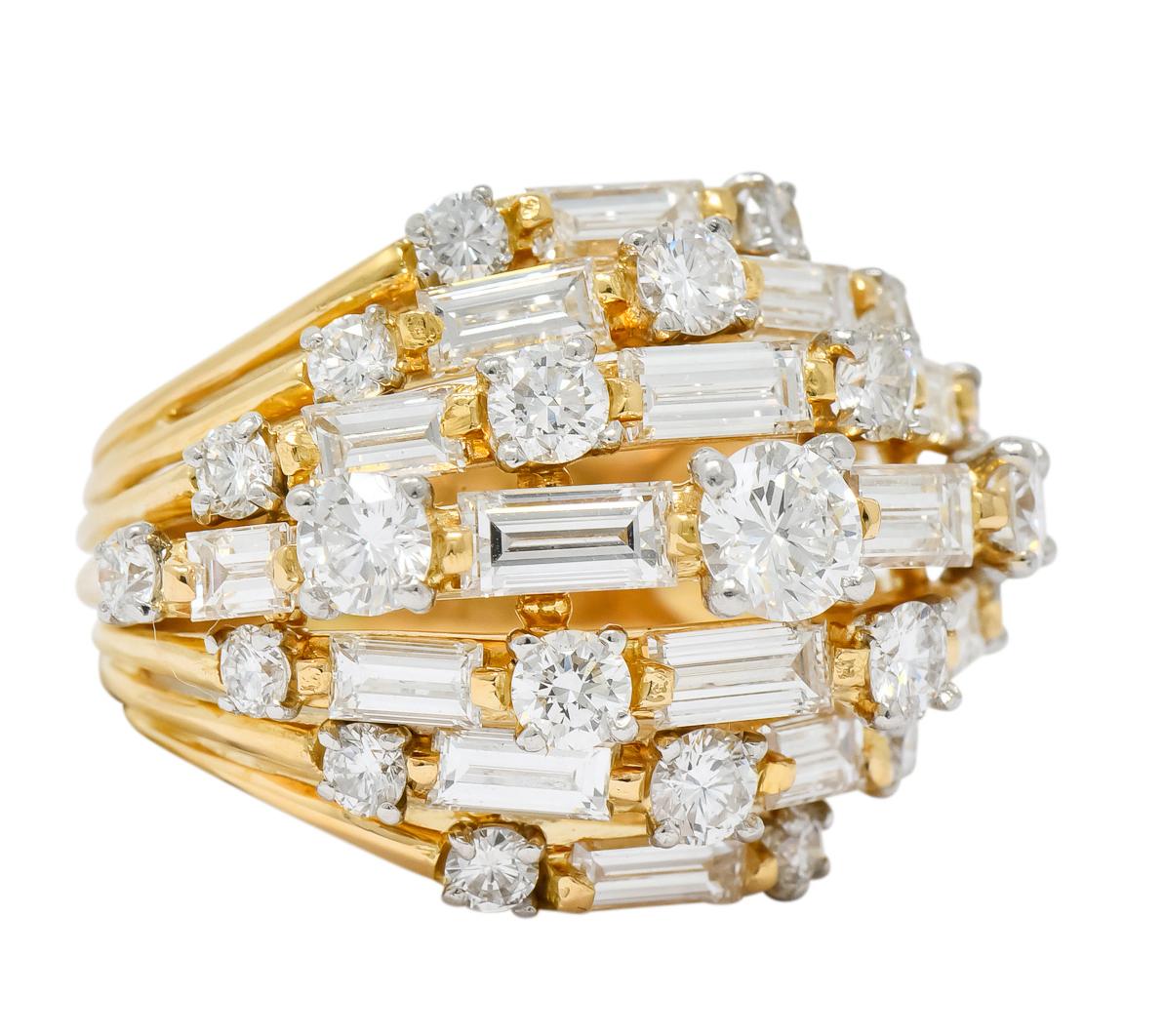Featuring a dynamic design of seven sections converging as a tapered dome

Set to front with alternating round brilliant and baguette cut, alternating, weighing approximately 4.30 carats total, F to G color and VS clarity

Circa 1960's

Maker's mark