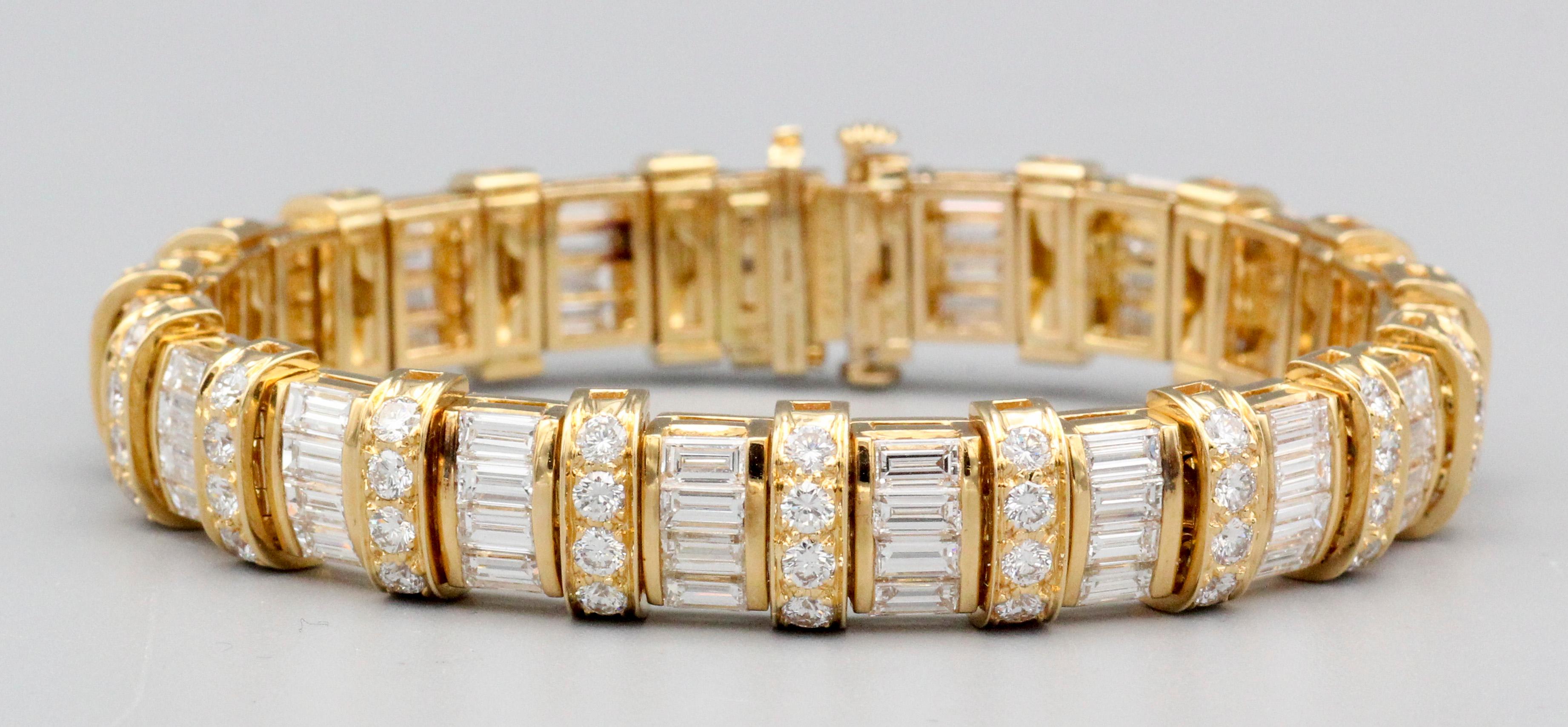 The Oscar Heyman Baguette and Brilliant Cut Diamond 18k Yellow Gold Bracelet is a masterpiece that epitomizes luxury, craftsmanship, and timeless elegance. Oscar Heyman, known for its exceptional jewelry creations, has likely crafted this bracelet