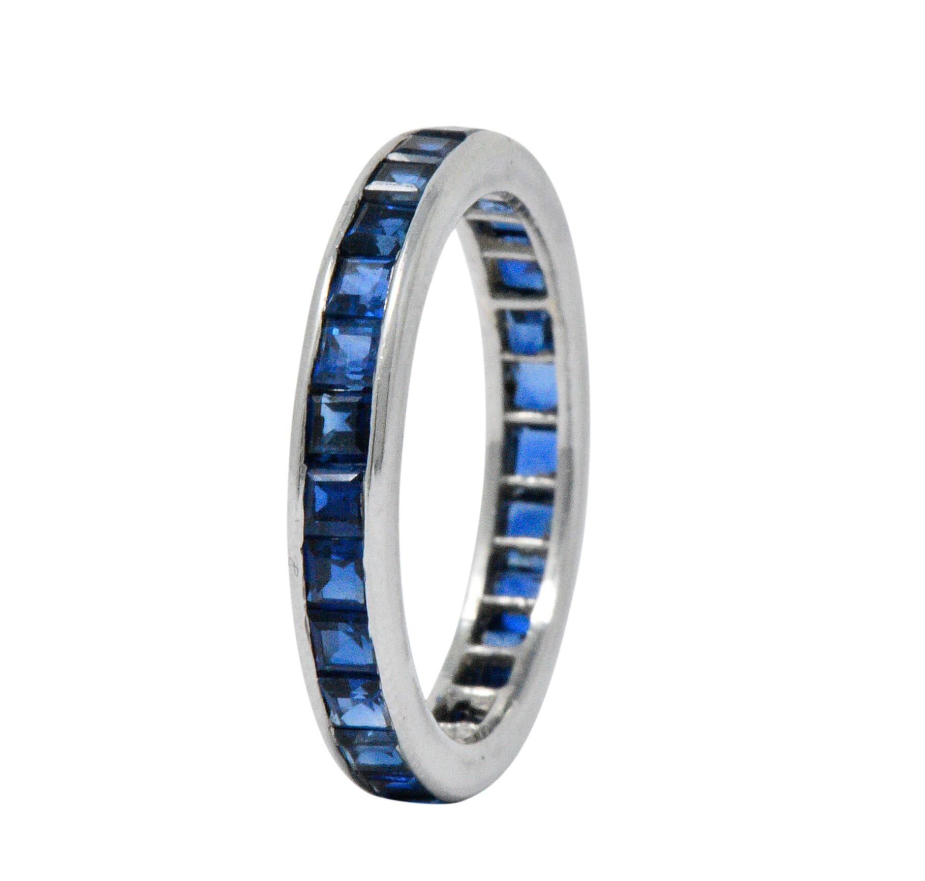 Designed as eternity band with royal blue, square calibré cut sapphires 

Channel set, weighing approximately 2.70 carats total

Stamped PT 950 with maker's mark for Oscar Heyman Brothers, also numbered

Ring Size: 6 & not sizable

Top Measures: 3