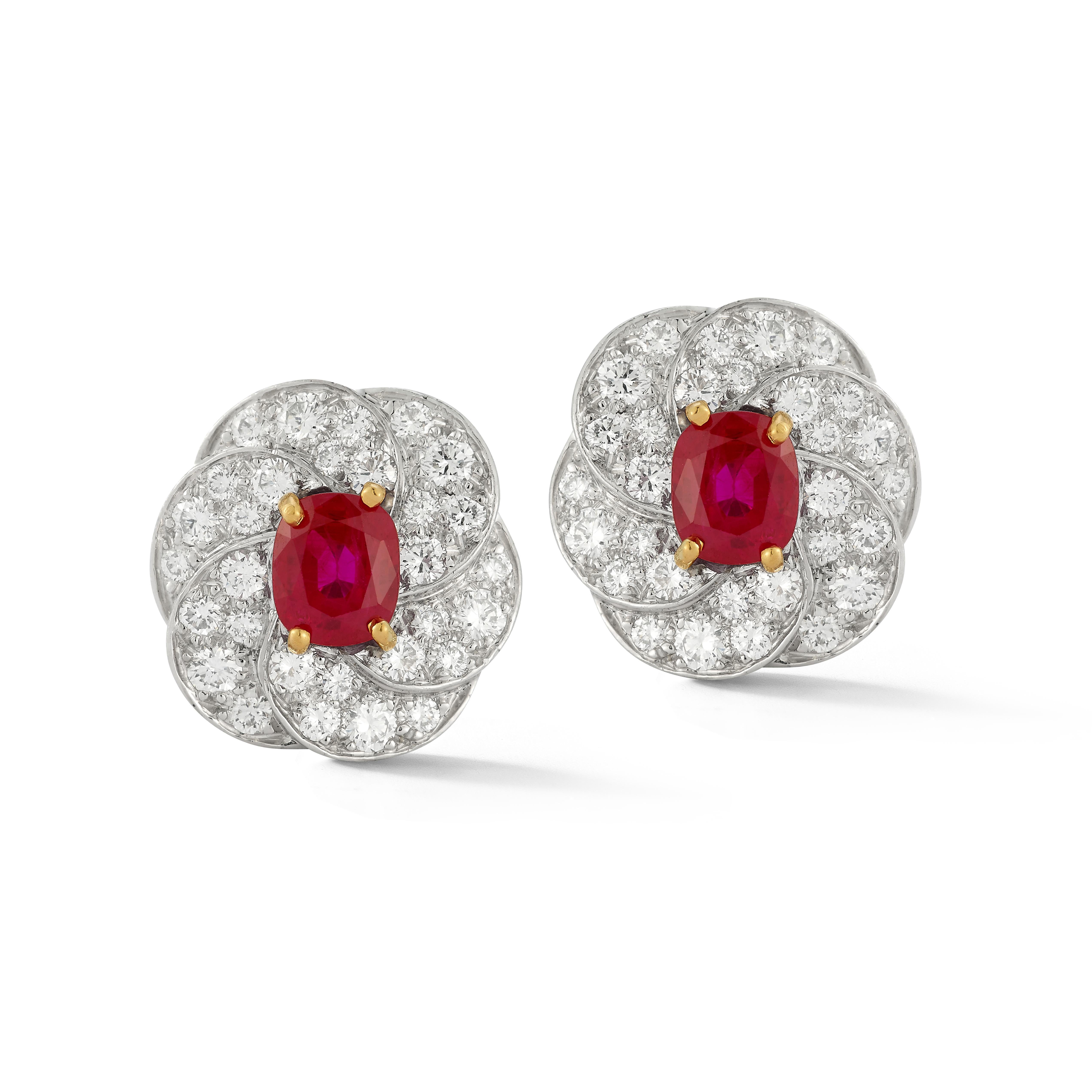 Oscar Heyman Brothers Certified Burmese Ruby Earrings

A pair of platinum and 18 karat gold earrings set with 2 oval cut Burmese rubies and 60 round cut diamonds

Total Approximate Ruby Weight: 2.05 carats

Accompanied by an AGL report stating the