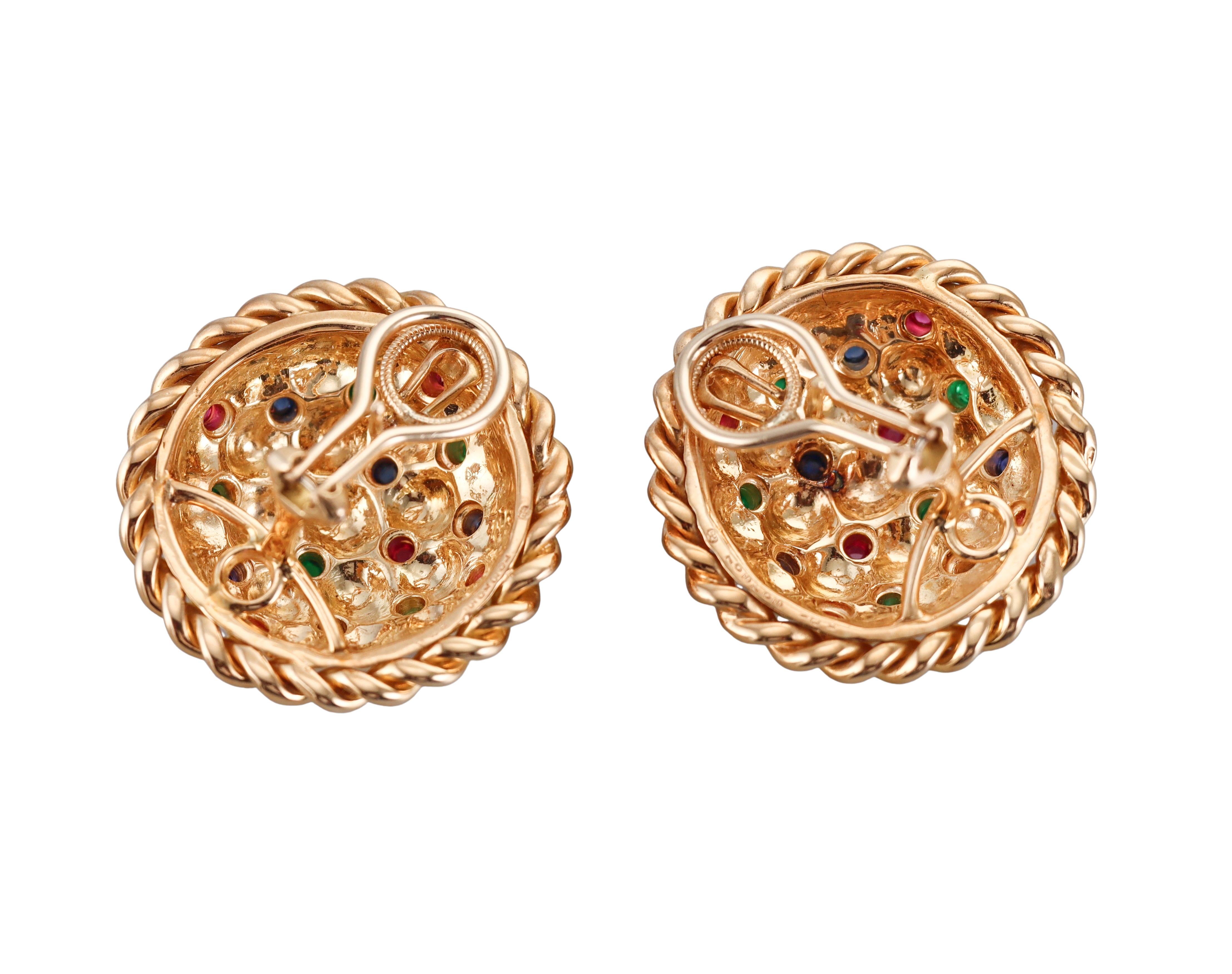A pair of large 18k yellow gold basketweave earrings by Oscar Heyman Bros, featuring emerald, ruby and sapphire cabochons.
Earrings measure 1 3/16